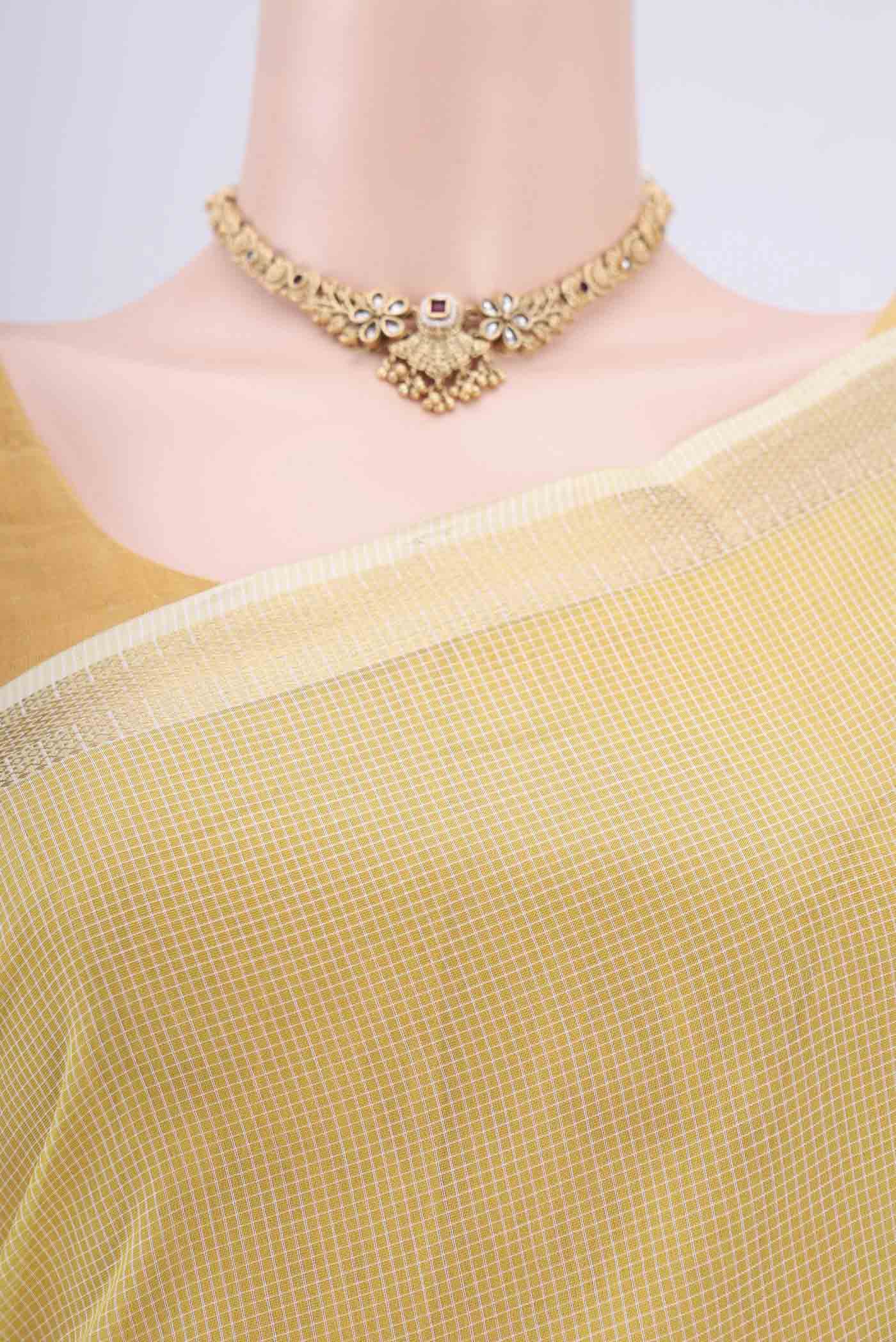 Border image of Lemon Yellow Maheshwari Silk Cotton Saree with Checked design on the body and Zari Border. 