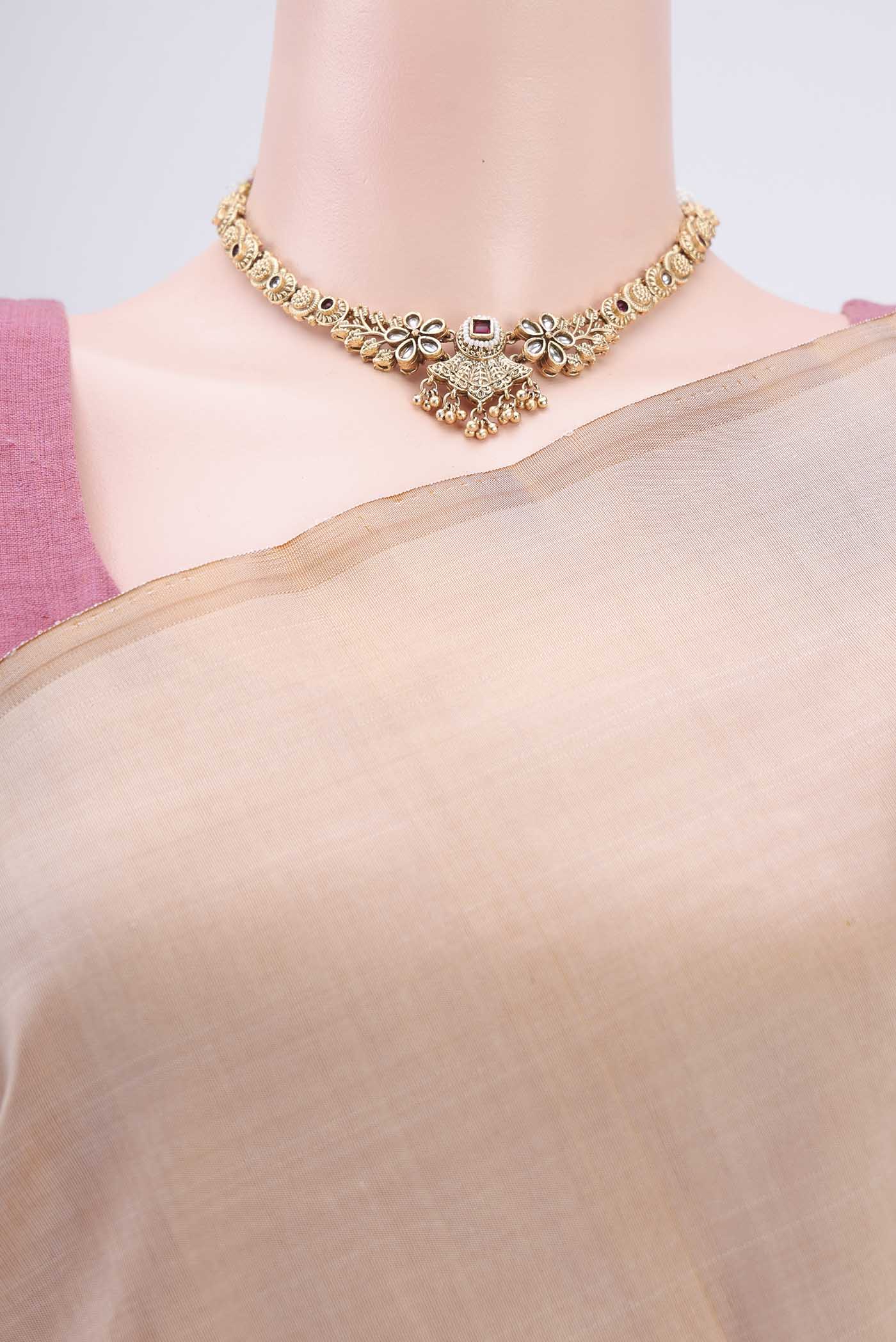 Border image of Beige Kanjivaram Silk Saree with Zari Butta on the body and Temple Border. 