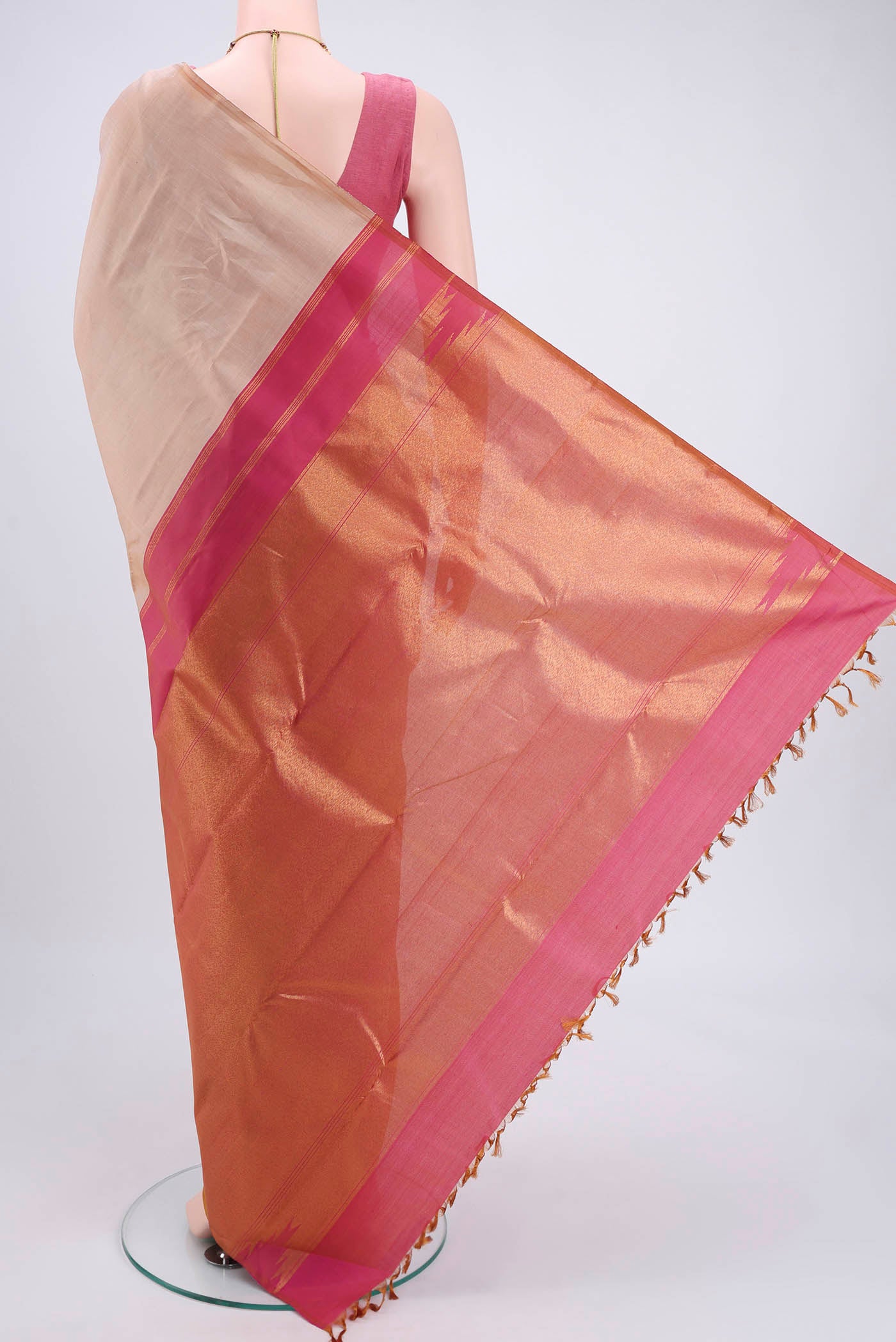 Flat view of Beige Kanjivaram Silk Saree with Zari Butta on the body and Temple Border. 