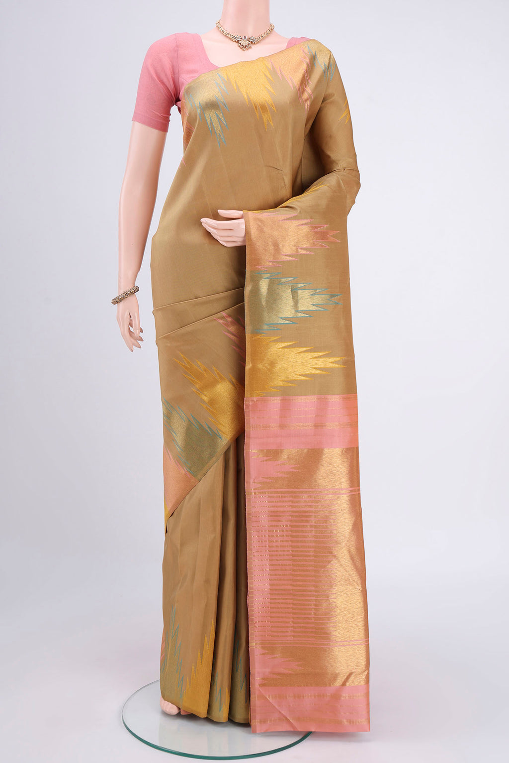 Dark Beige Kanjivaram Silk Saree with Plain Body and Temple Border.  displayed on a mannequin