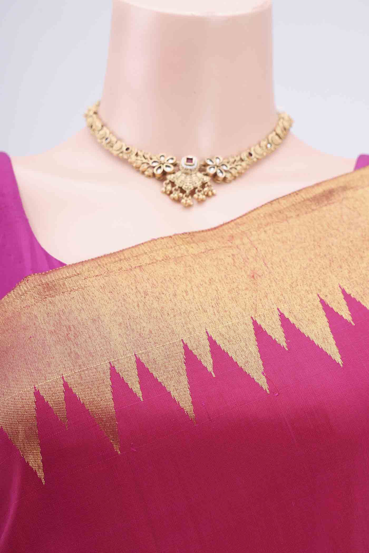 Border image of Rani Pink Kanjivaram Silk Saree with Plain Body and Rising Temple Border. 