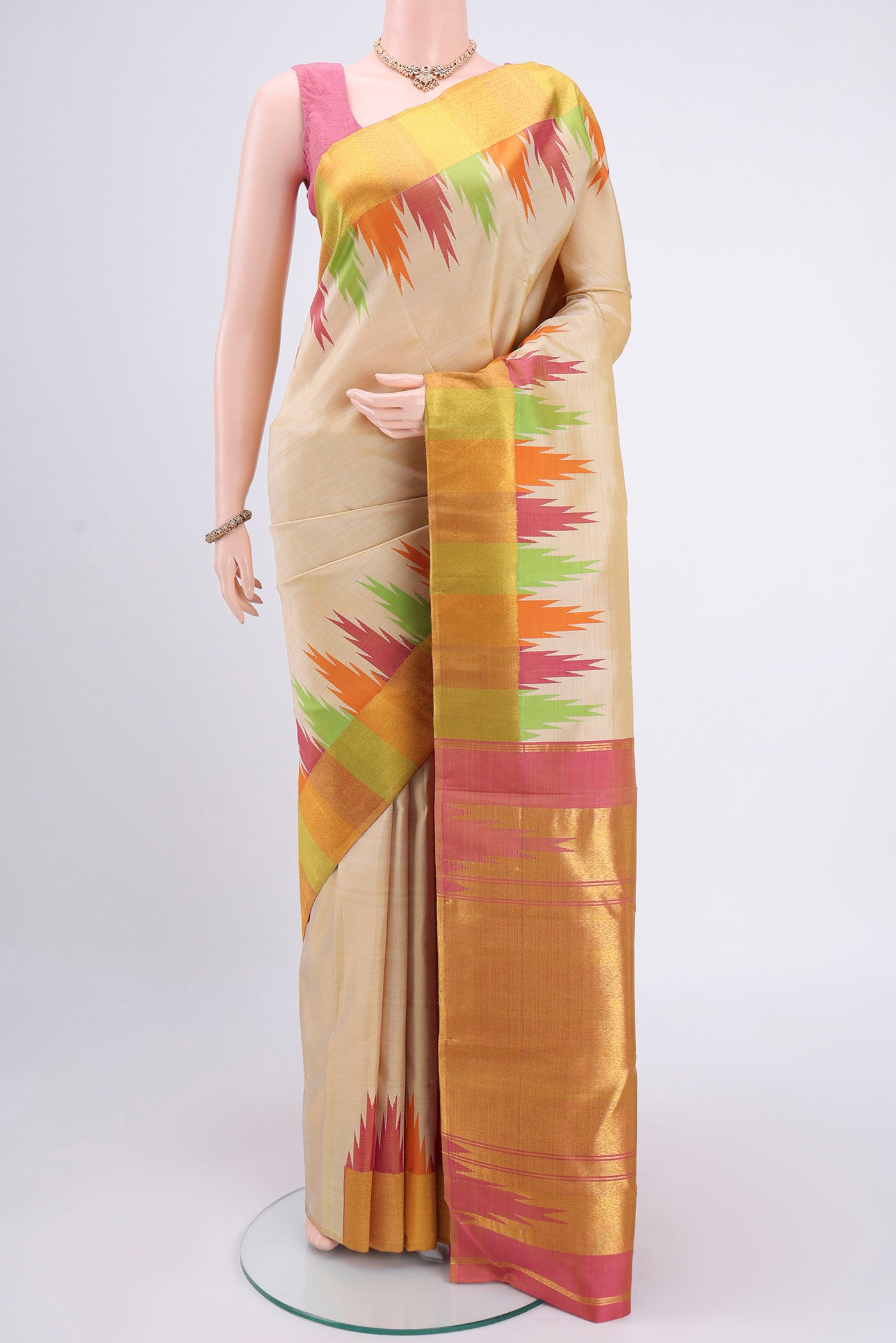 Beige Kanjivaram Silk Saree with Plain Body and Temple Border.  displayed on a mannequin