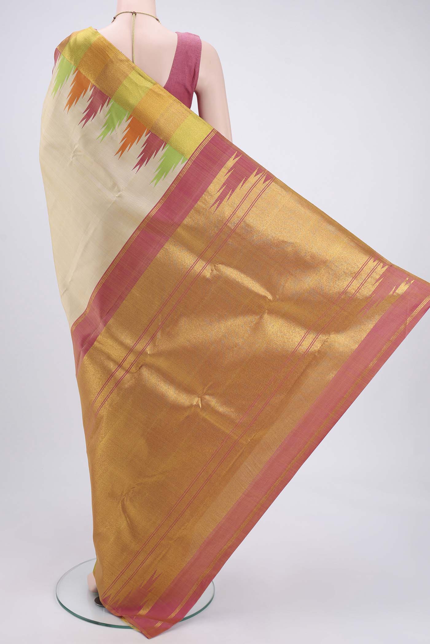 Flat view of Beige Kanjivaram Silk Saree with Plain Body and Temple Border. 