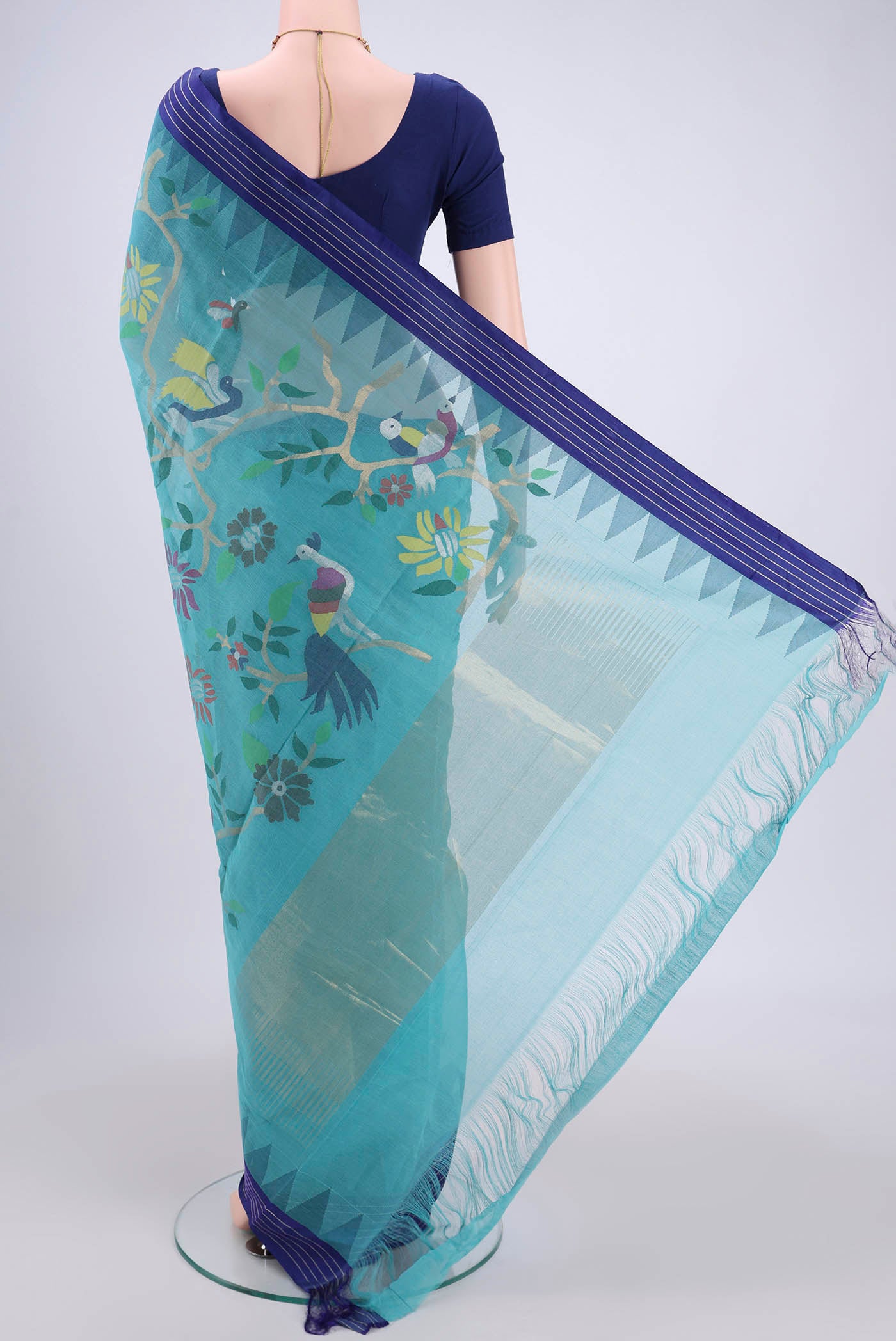Flat view of Sky Blue Uppada Cotton Saree with Zari And Thread Butta on the body and Thread Border. 