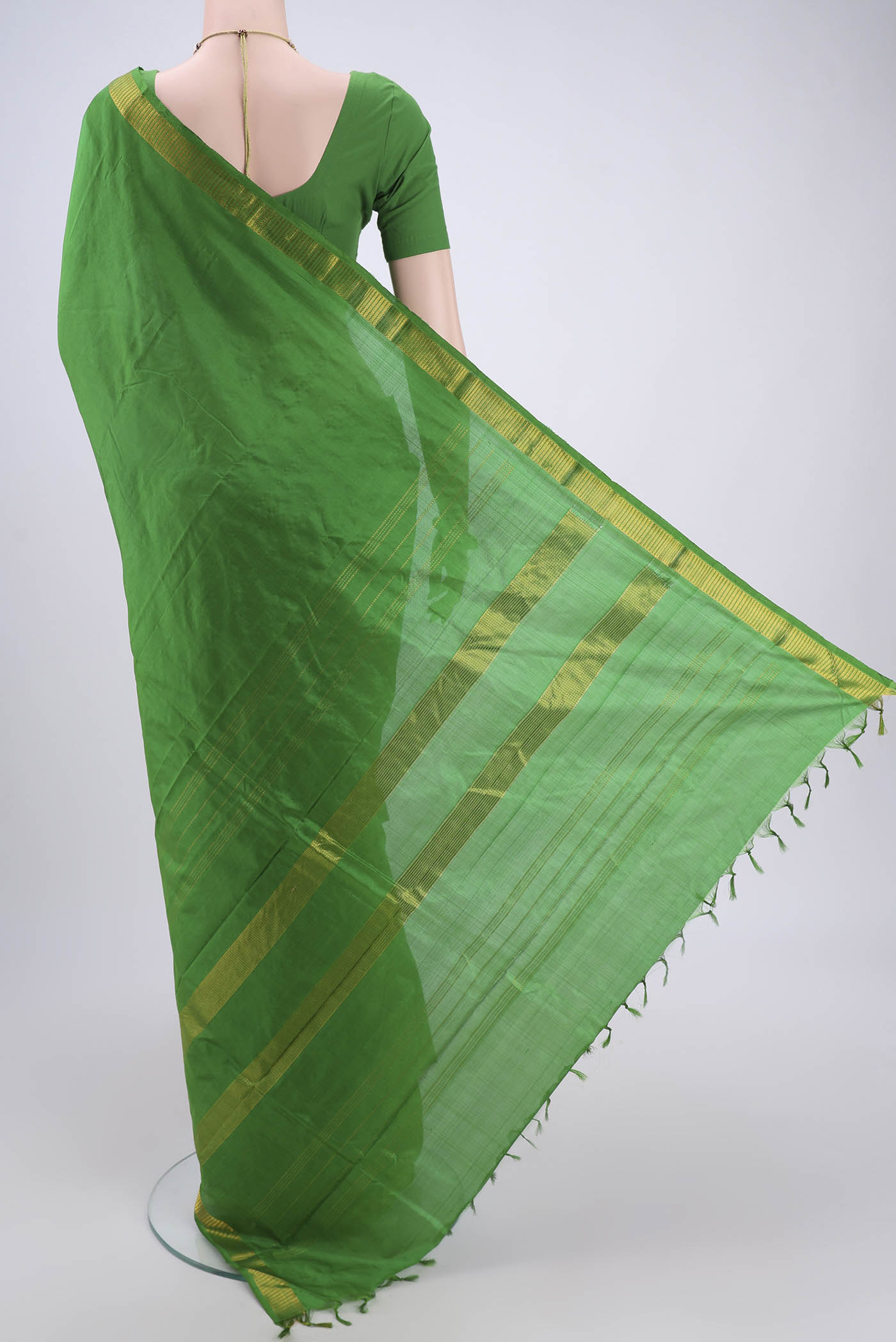 Flat view of Green Dual Tone Kanchipuram Silk Saree with Plain Body and Zari Border. 