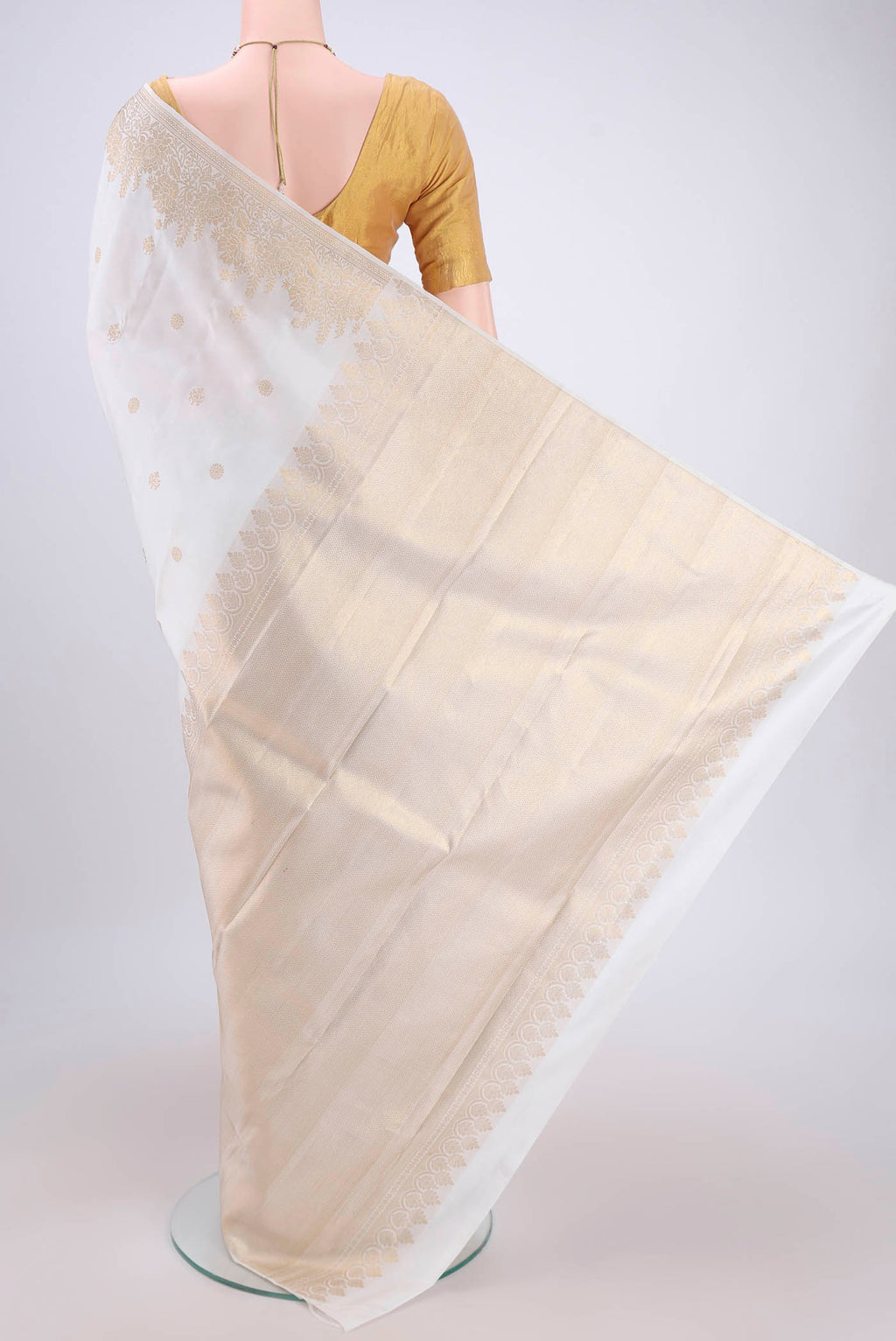 Flat view of White Dual Tone Kanjivaram Silk Saree with Zari Butta on the body and Zari Border. 