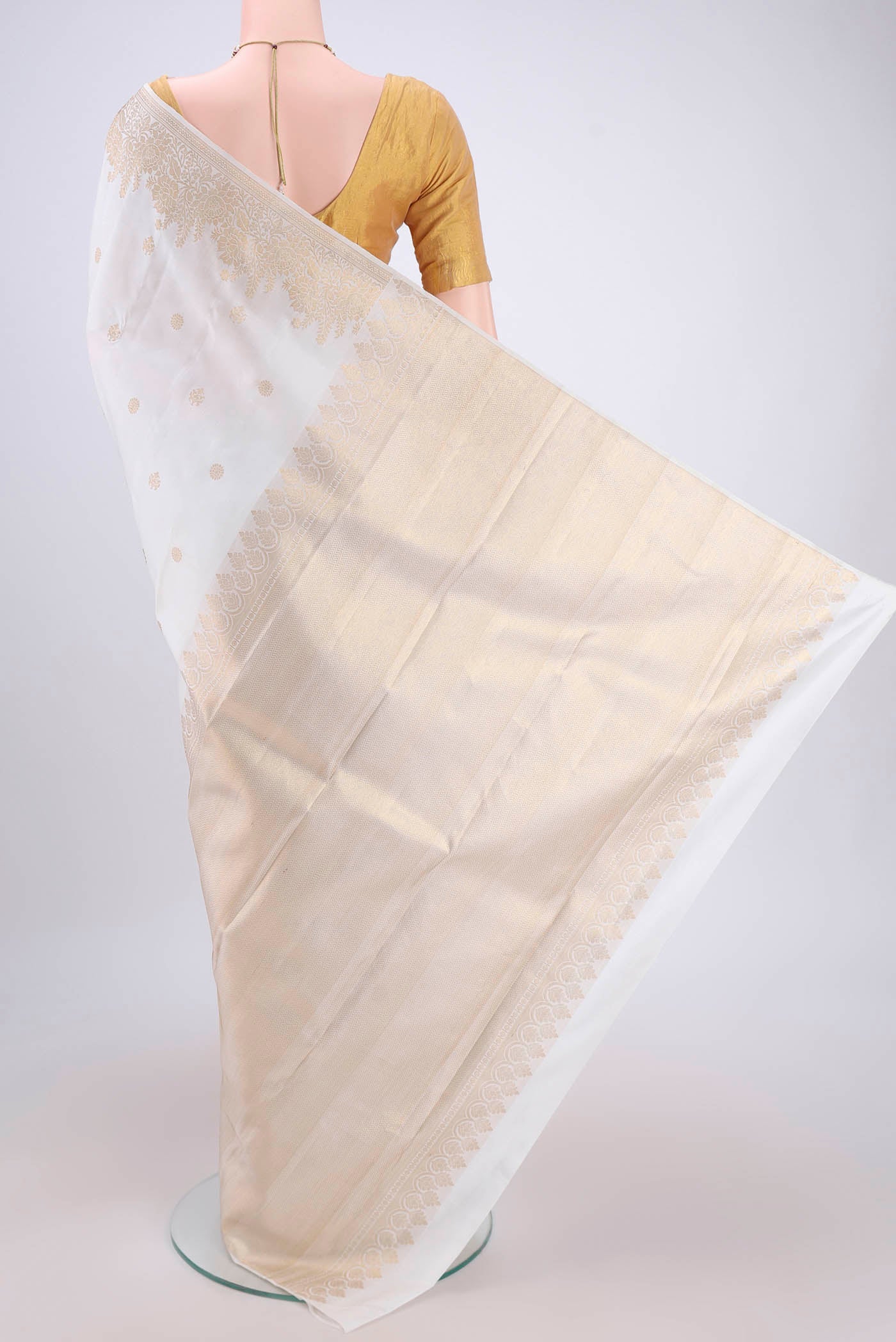 Flat view of White Dual Tone Kanjivaram Silk Saree with Zari Butta on the body and Zari Border. 