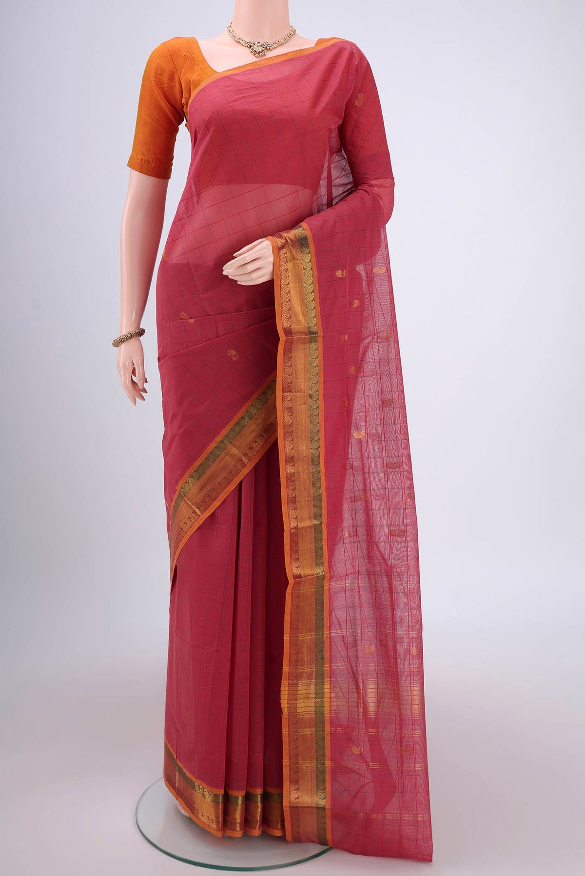 Light Magenta Venkatagiri Cotton Saree with Zari Butta on the body and Zari Border.  displayed on a mannequin