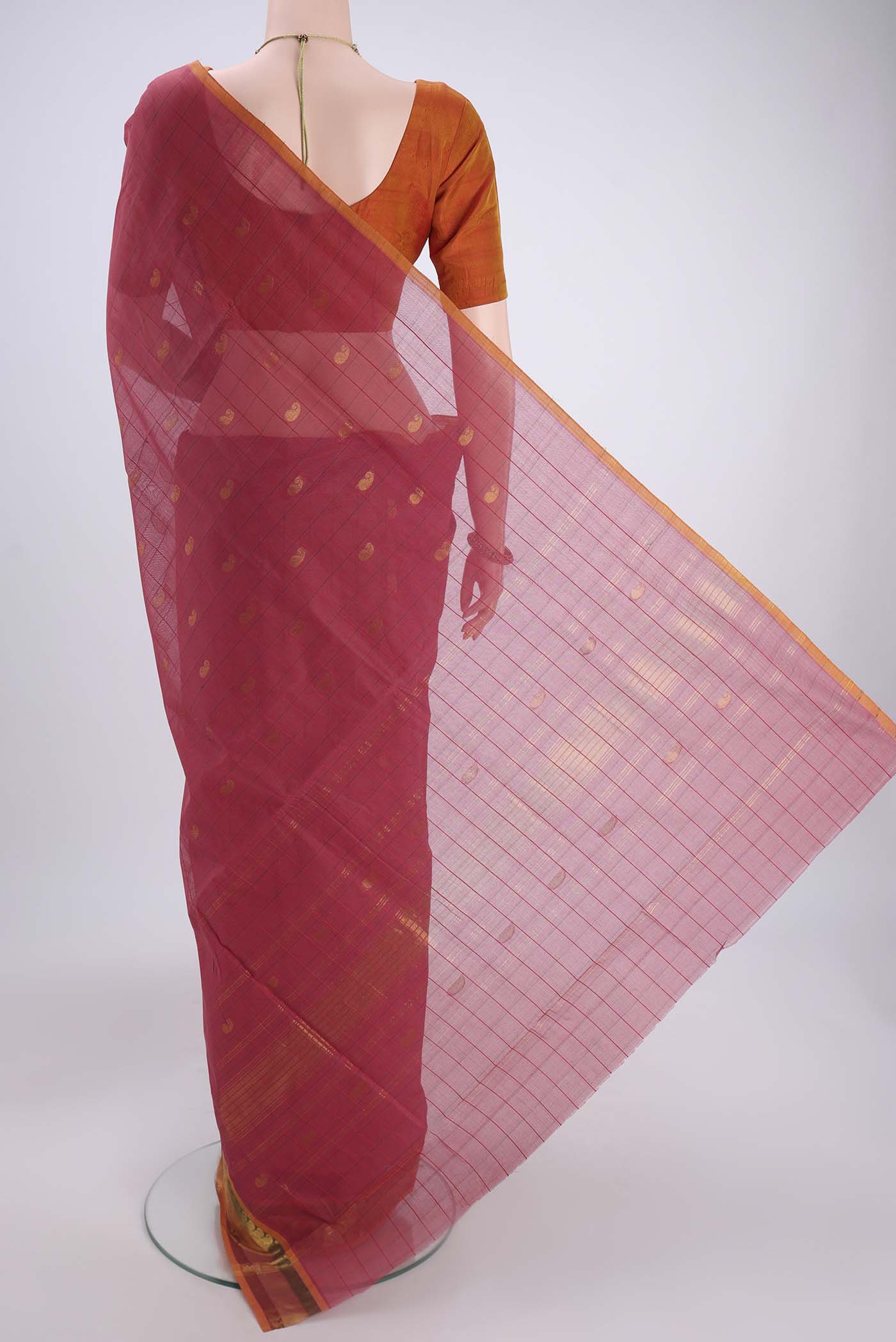 Flat view of Light Magenta Venkatagiri Cotton Saree with Zari Butta on the body and Zari Border. 