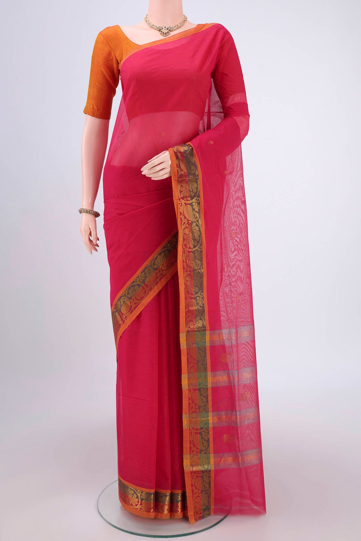 Red Venkatagiri Cotton Saree with Zari Butta on the body and Zari Border.  displayed on a mannequin