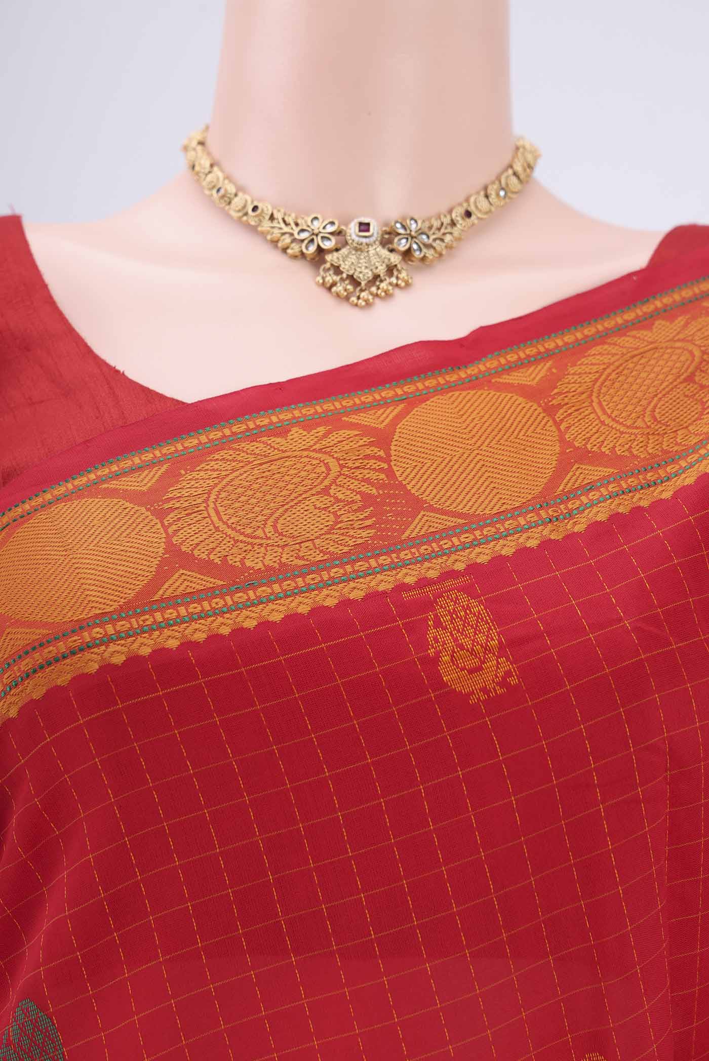 Border image of Red Blended Poly Cotton Saree with Zari Butta on the body and Zari Border. 