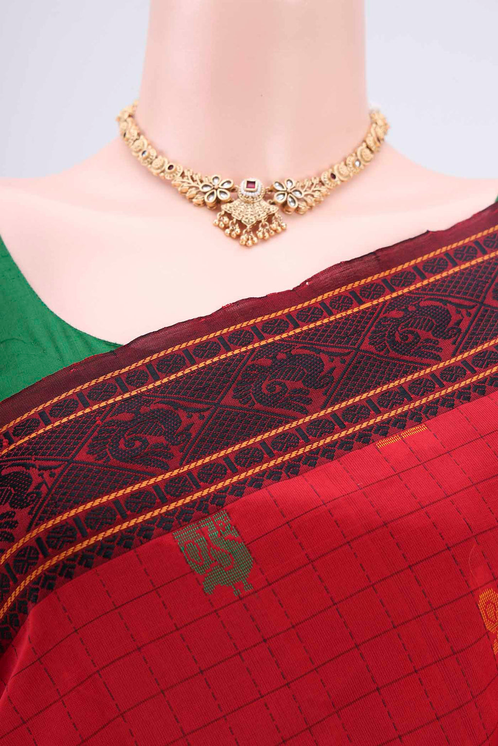 Border image of Red Blended Poly Cotton Saree with Checked design on the body and Thread Border. 