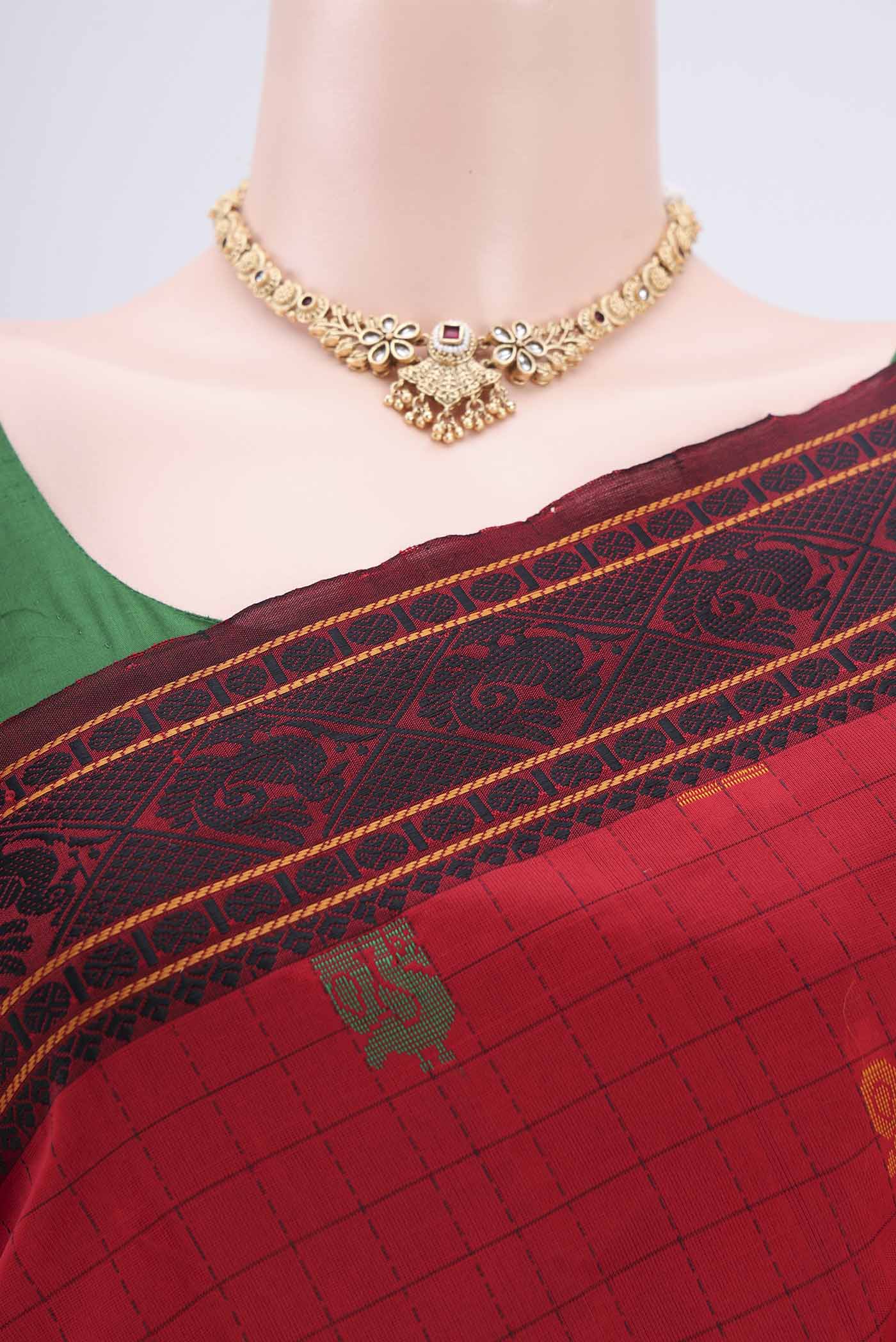 Border image of Red Blended Poly Cotton Saree with Checked design on the body and Thread Border. 