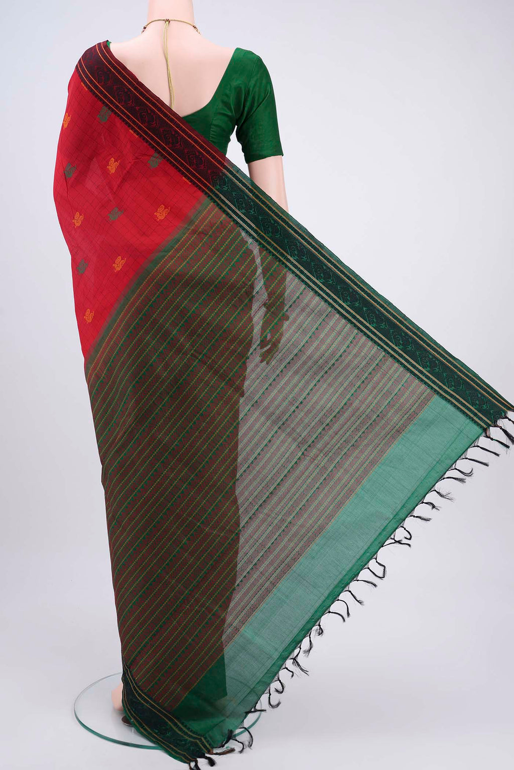Flat view of Red Blended Poly Cotton Saree with Checked design on the body and Thread Border. 