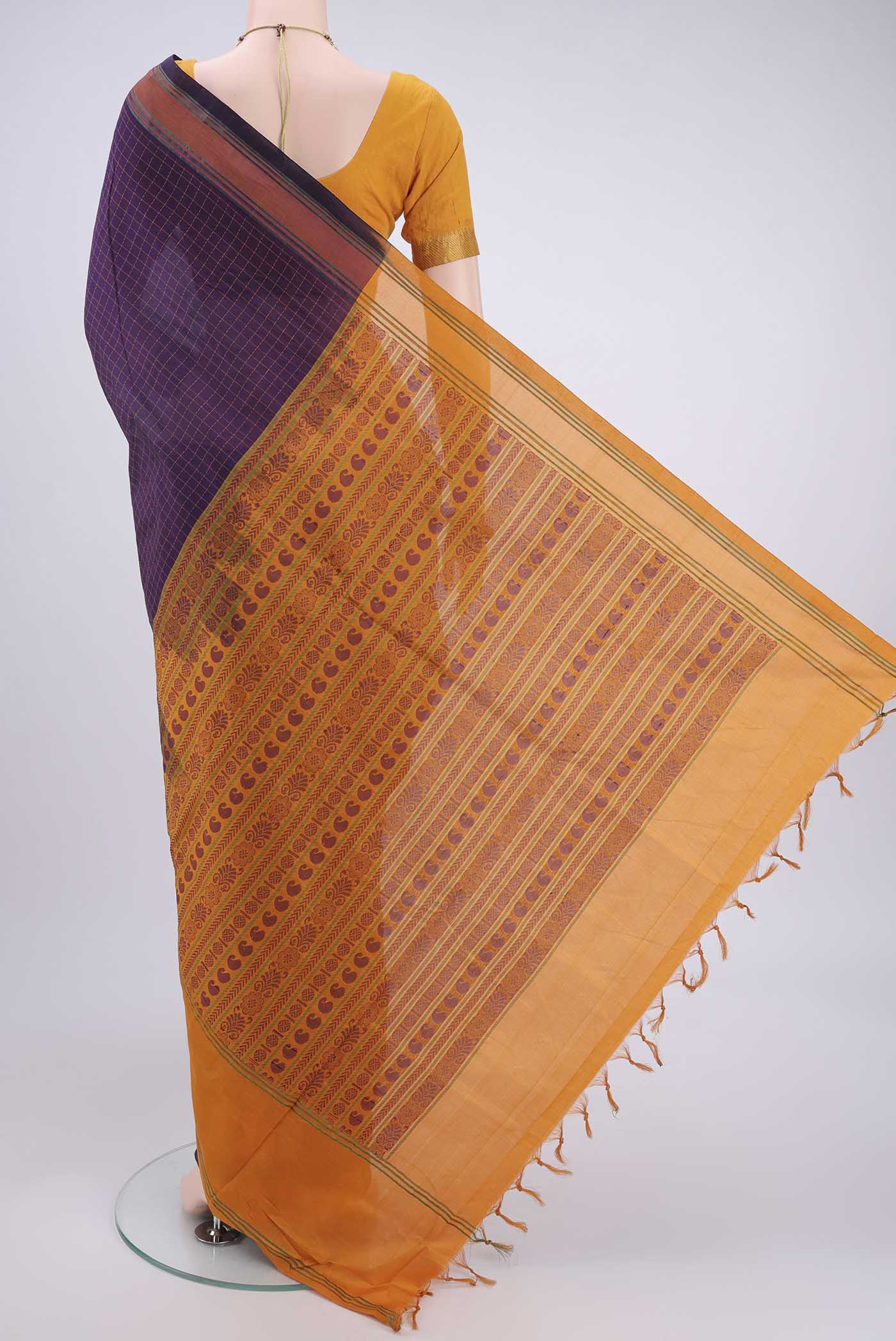 Flat view of Purple Blended Poly Cotton Saree with Checked design on the body and Thread Border. 