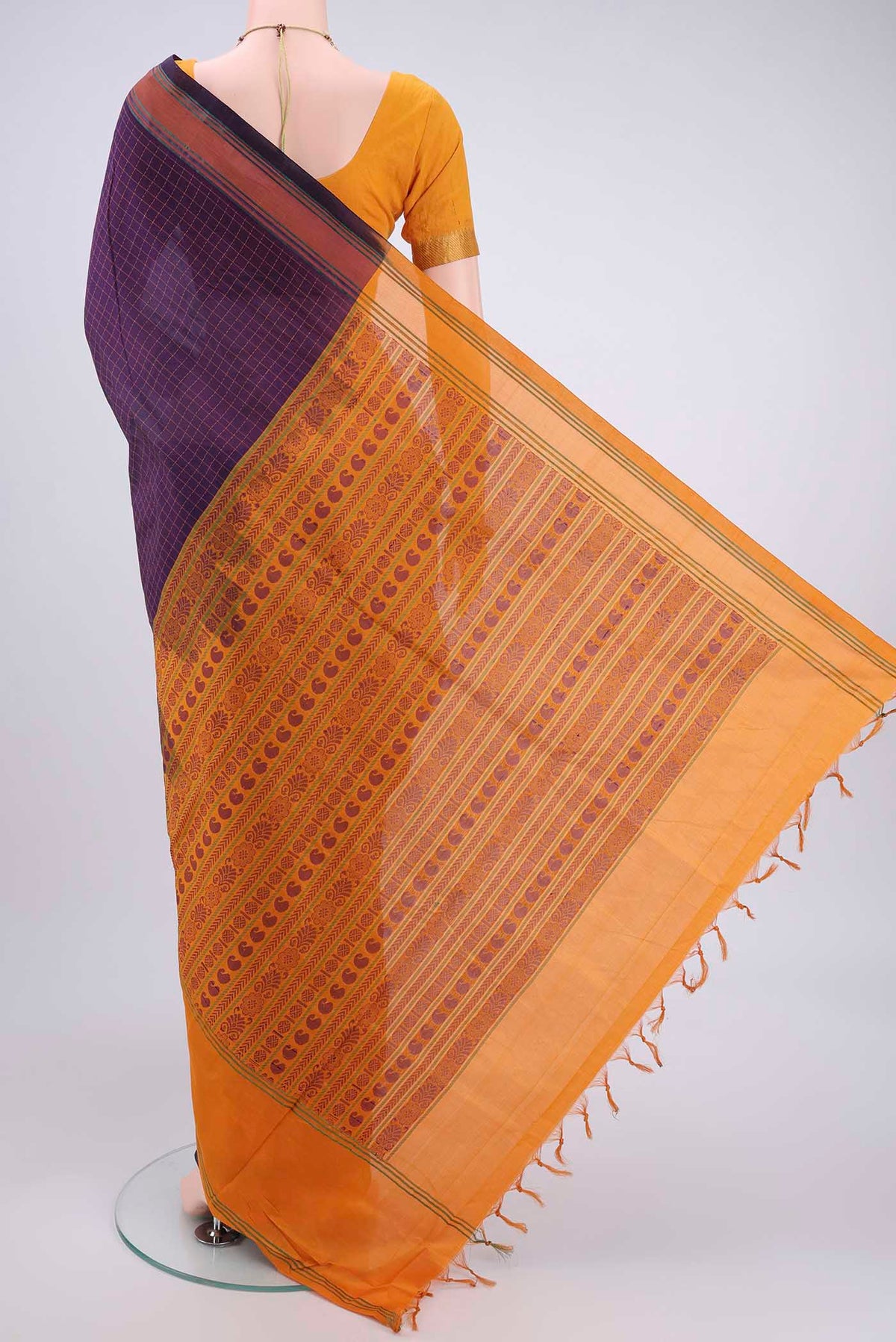 Flat view of Purple Blended Poly Cotton Saree with Checked design on the body and Thread Border. 