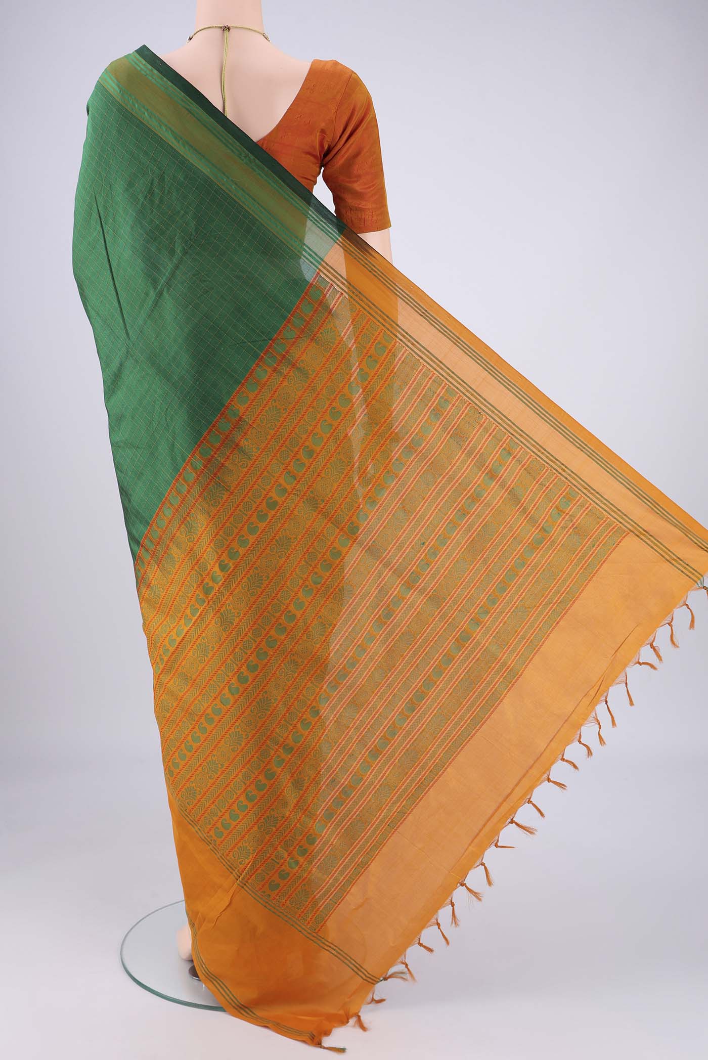 Flat view of Bottle Green Blended Poly Cotton Saree with Checked design on the body and Thread Border. 