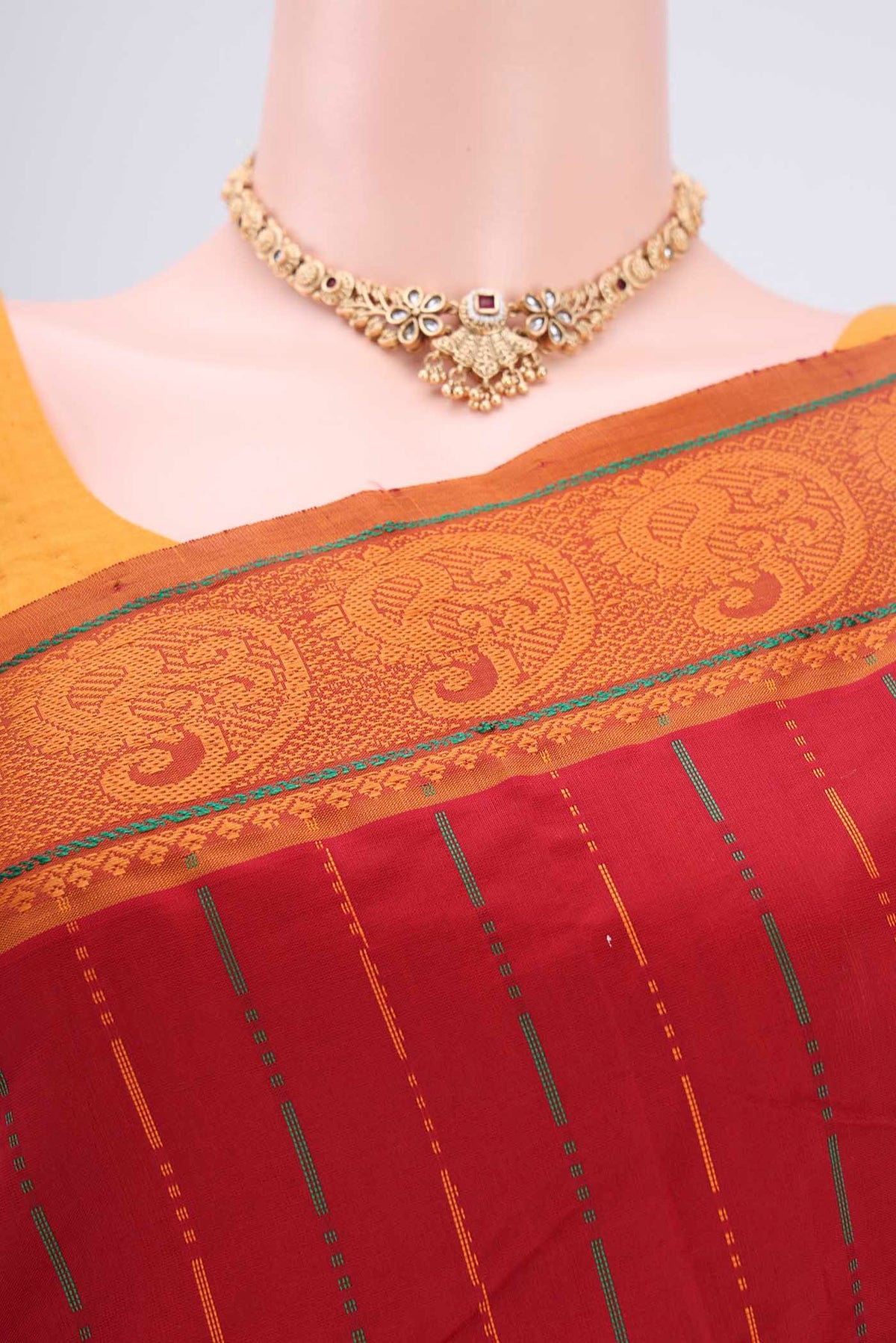 Border image of Red Blended Poly Cotton Saree with Stripes on the body and Thread Border. 