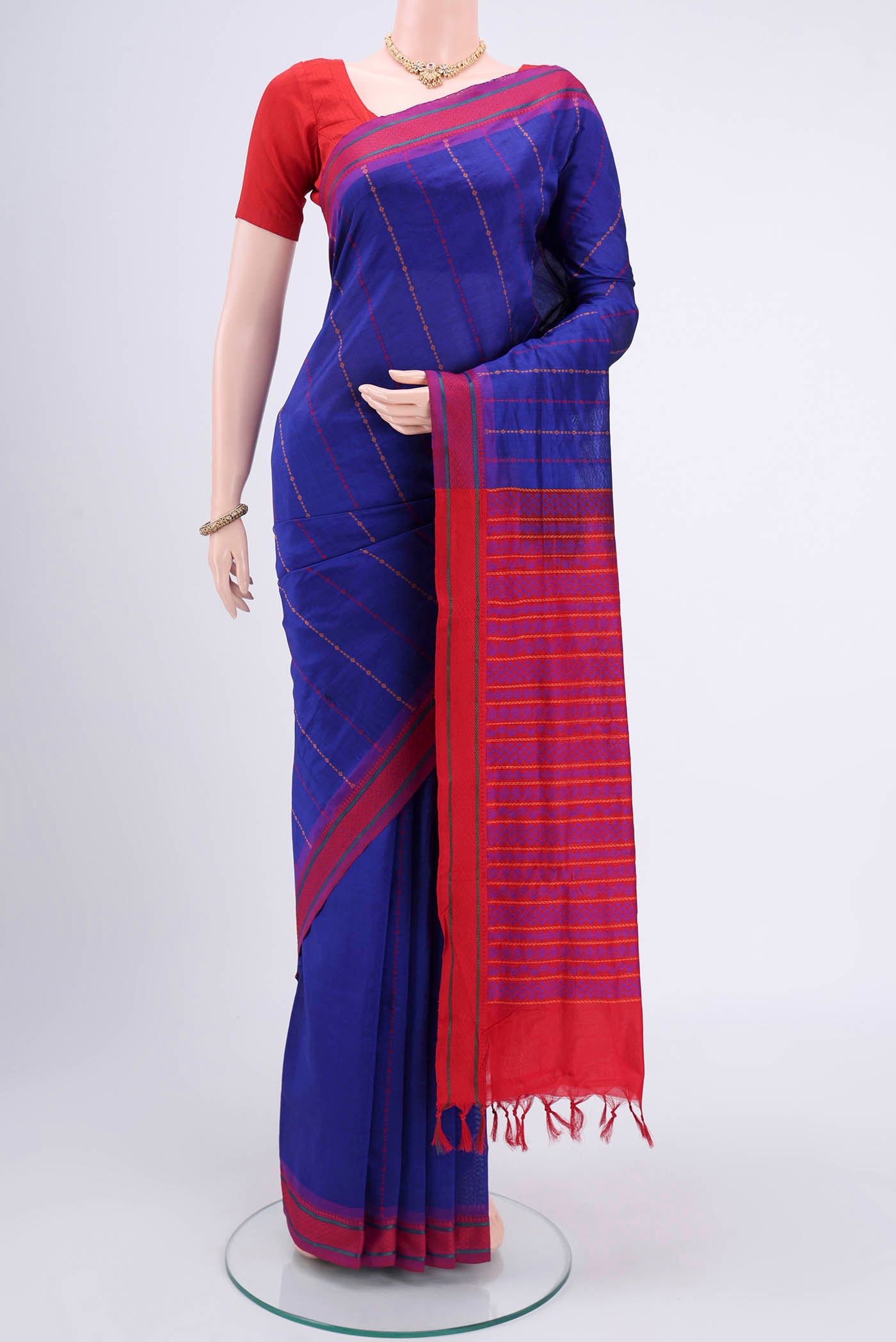 Navy Blue Blended Poly Cotton Saree with Stripes on the body and Thread Border.  displayed on a mannequin