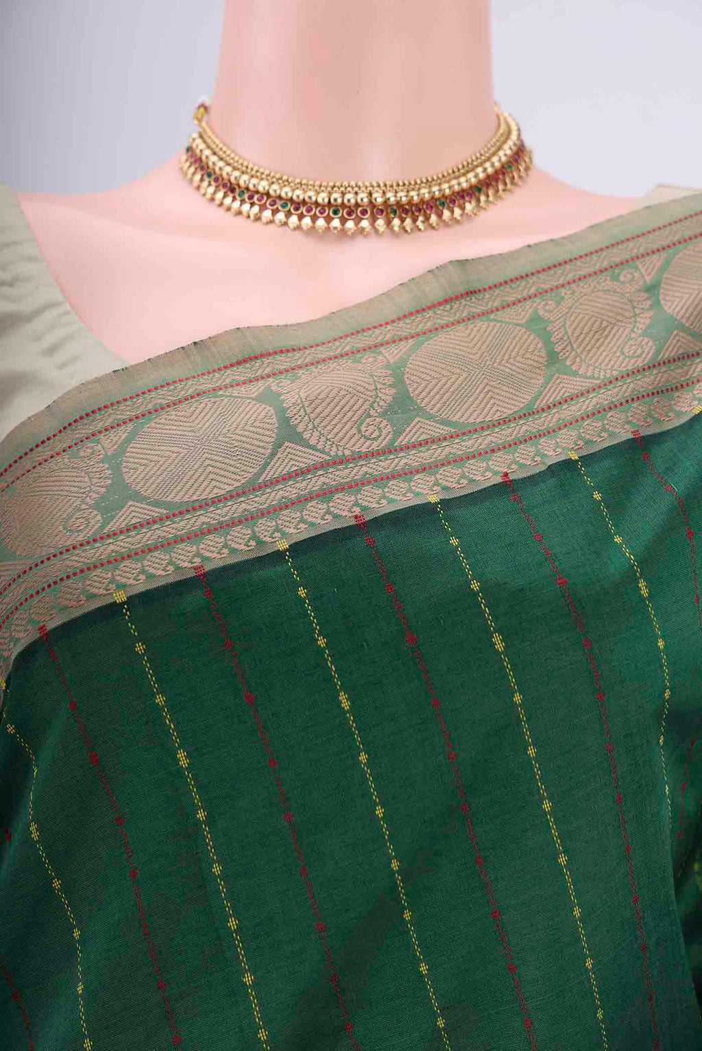 Border image of Bottle Green Blended Poly Cotton Saree with Stripes on the body and Thread Border. 
