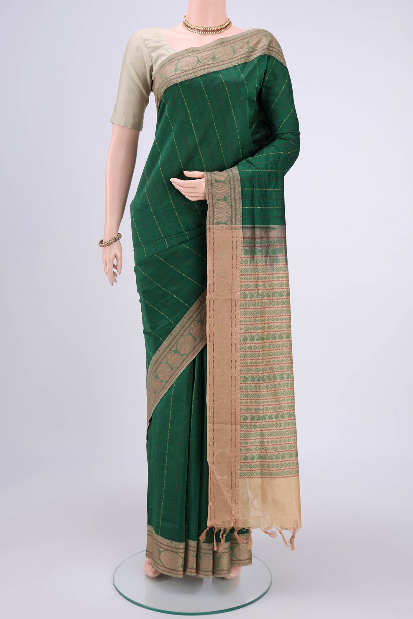 Bottle Green Blended Poly Cotton Saree with Stripes on the body and Thread Border.  displayed on a mannequin