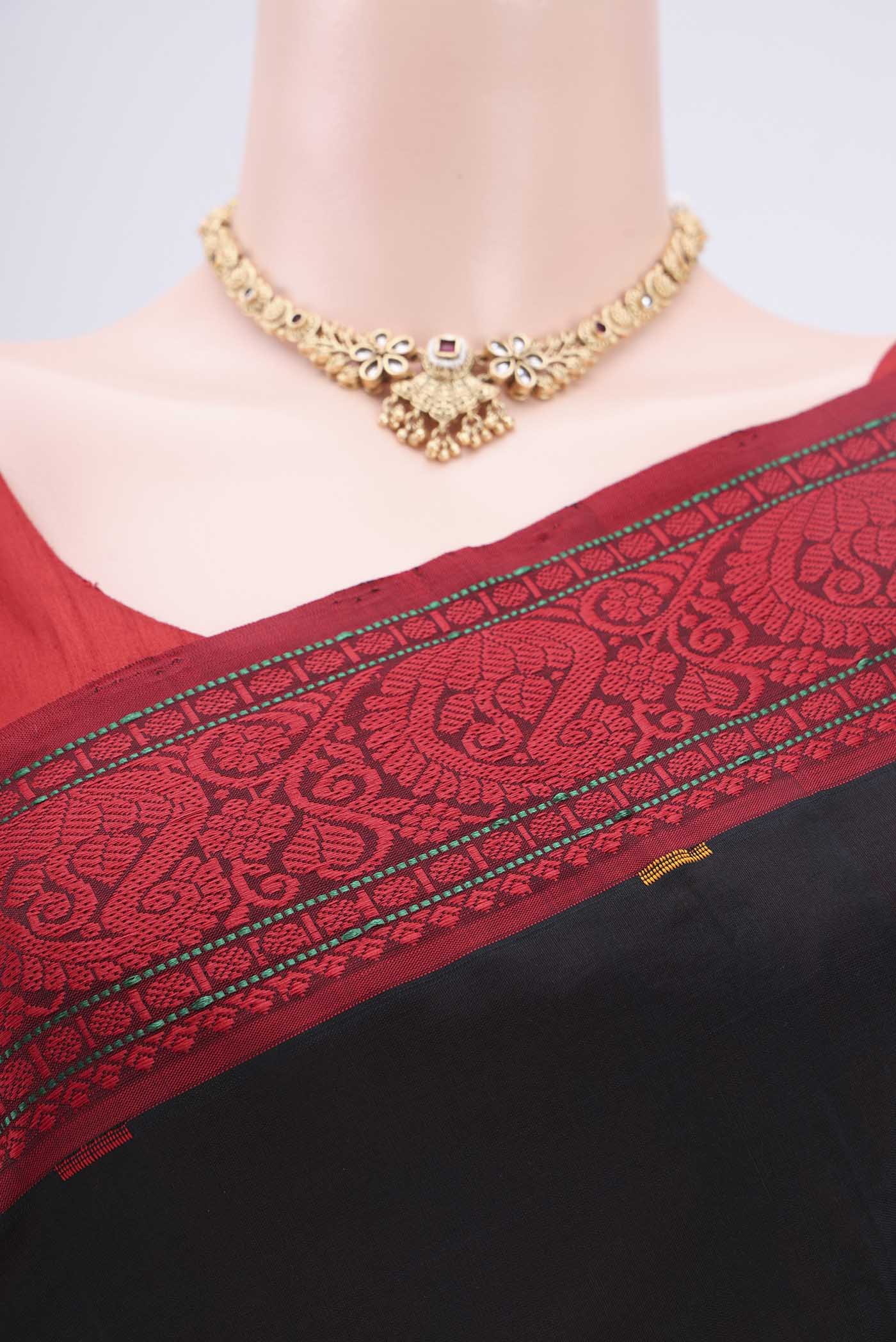 Border image of Black Blended Poly Cotton Saree with Thread Butta on the body and Thread Border. 