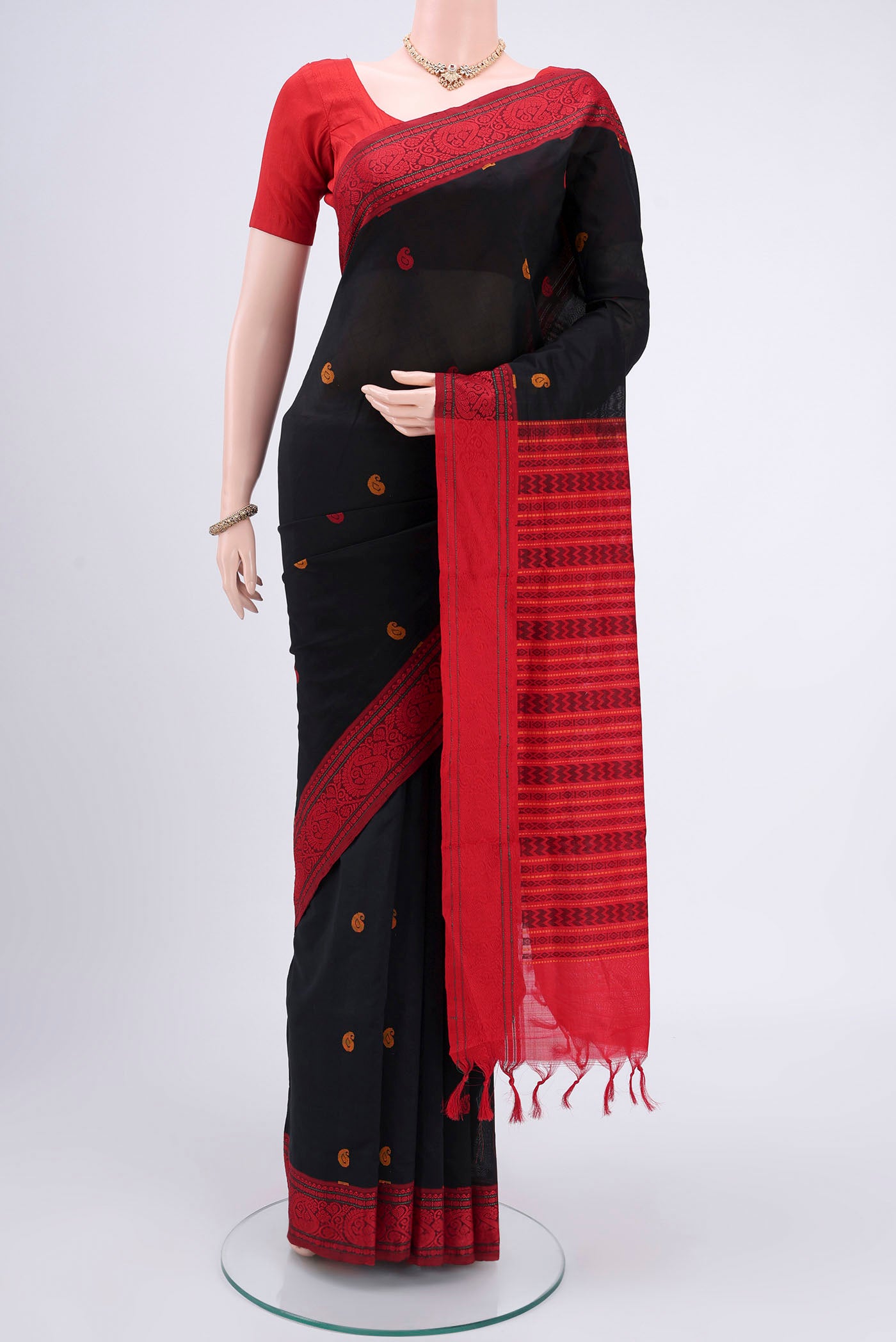 Black Blended Poly Cotton Saree with Thread Butta on the body and Thread Border.  displayed on a mannequin