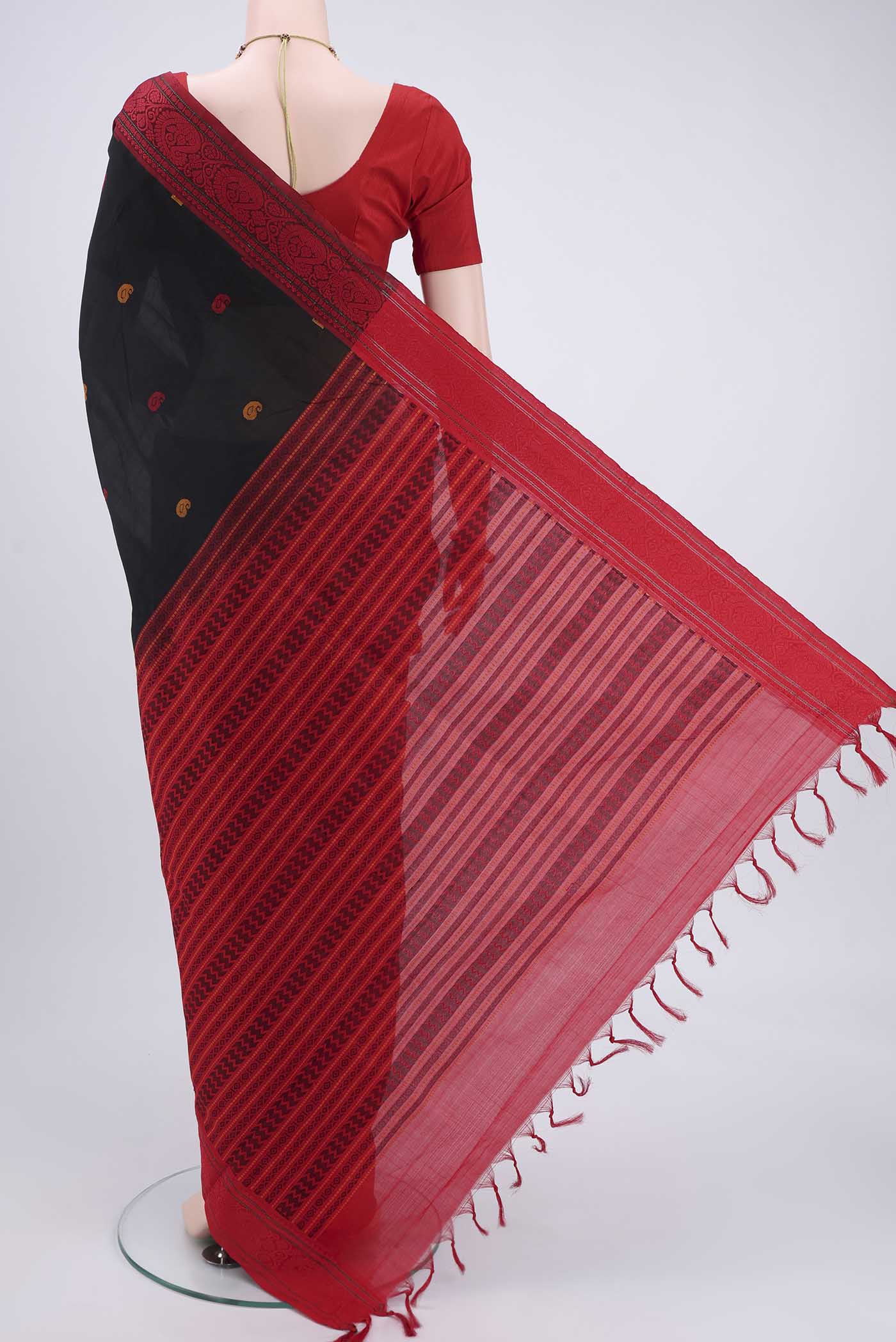 Flat view of Black Blended Poly Cotton Saree with Thread Butta on the body and Thread Border. 