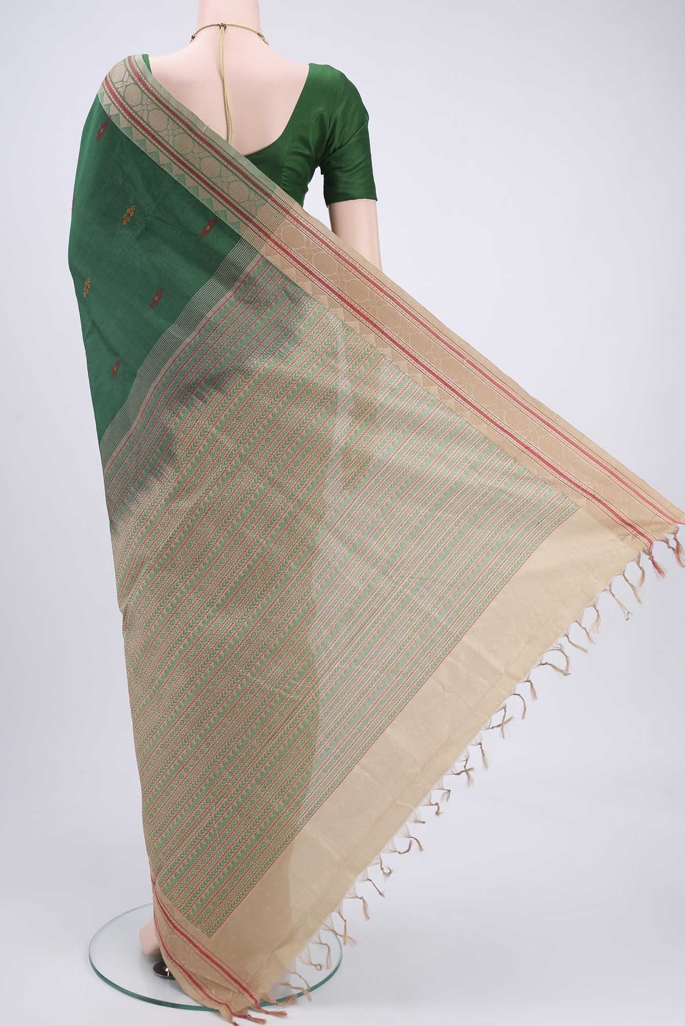 Flat view of Bottle Green Blended Poly Cotton Saree with Thread Butta on the body and Thread Border. 