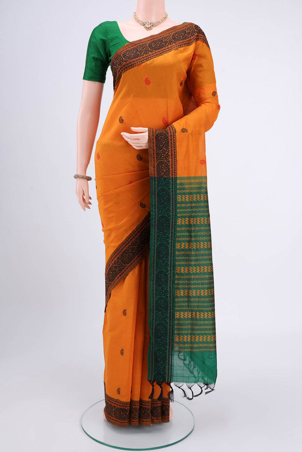 Mustard Blended Poly Cotton Saree with Thread Butta on the body and Thread Border.  displayed on a mannequin