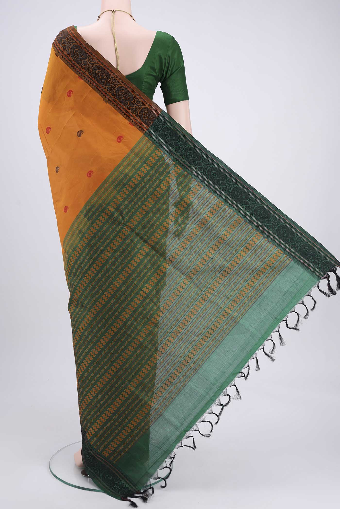 Flat view of Mustard Blended Poly Cotton Saree with Thread Butta on the body and Thread Border. 
