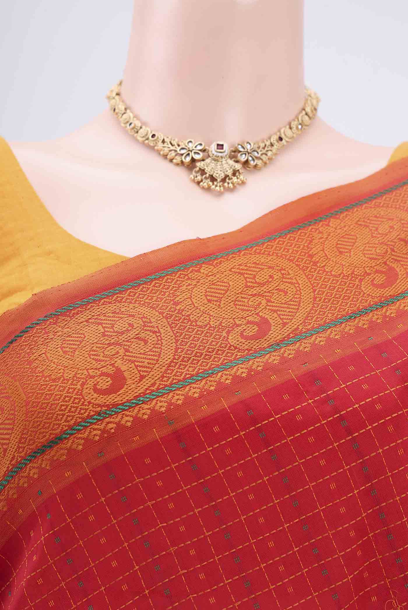 Border image of Red Blended Poly Cotton Saree with Checked design on the body and Thread Border. 