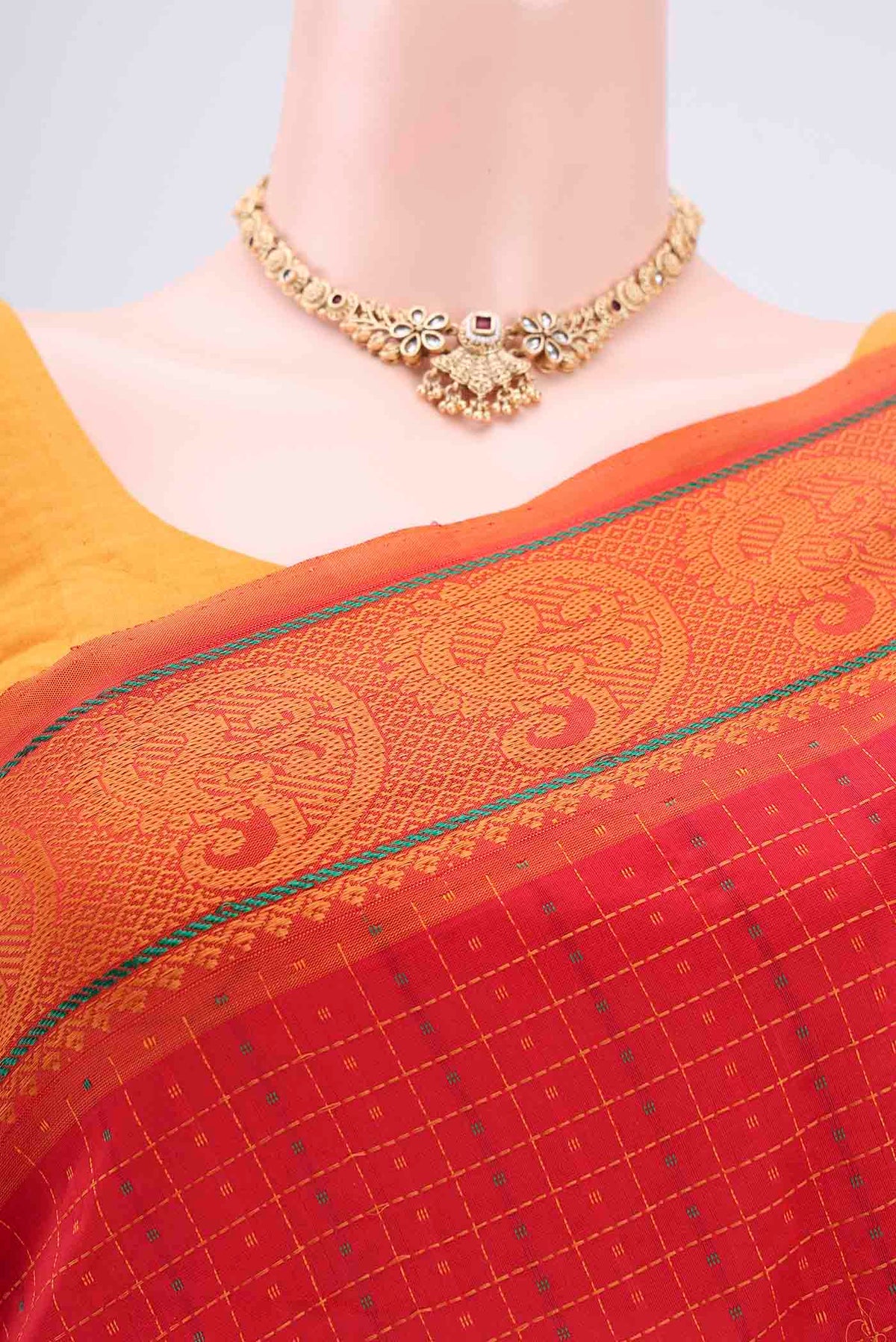 Border image of Red Blended Poly Cotton Saree with Checked design on the body and Thread Border. 