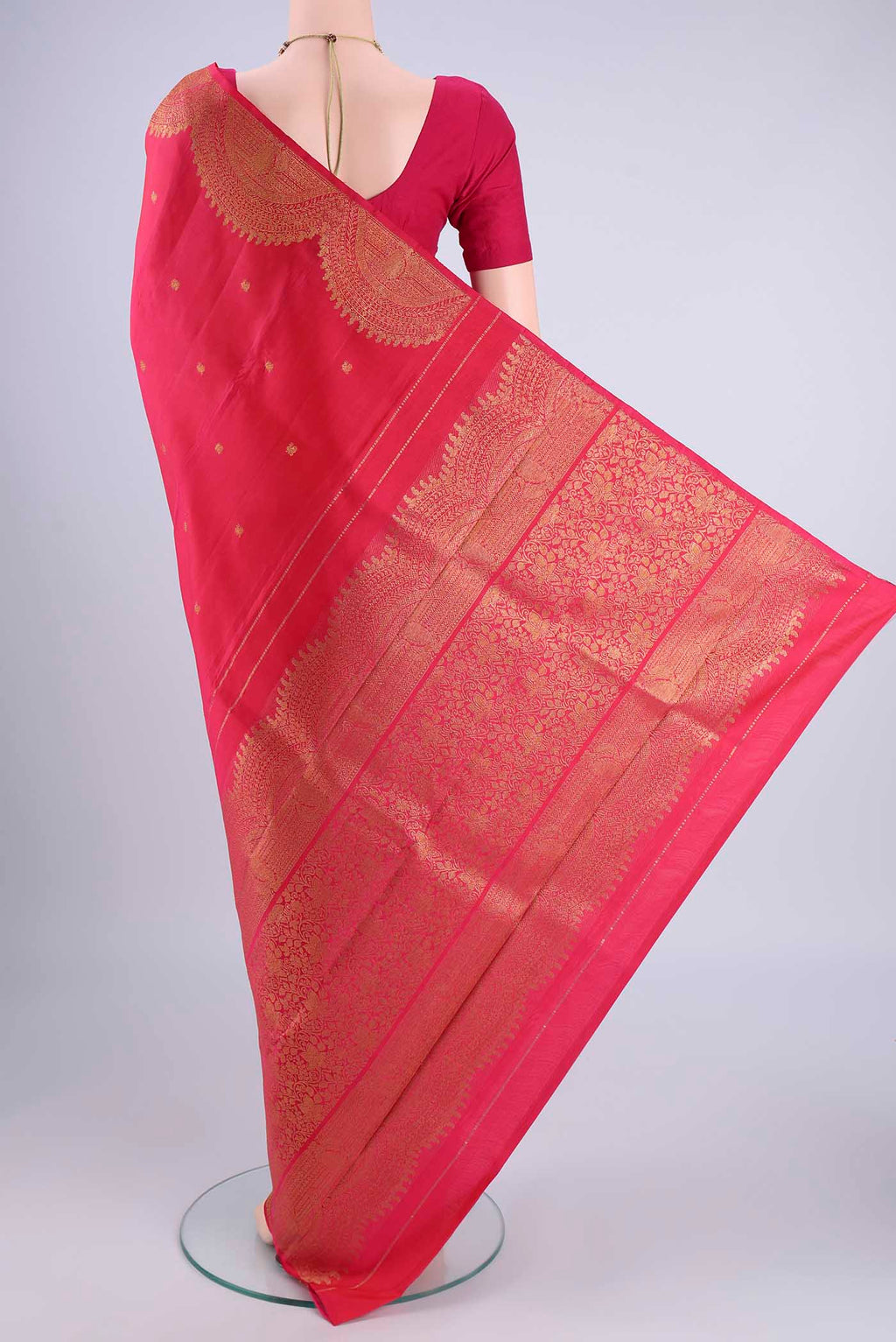 Flat view of Pure Silk Pure Zari Pink Kanchipuram Saree with Zari Butta on the body and Fancy Border. 