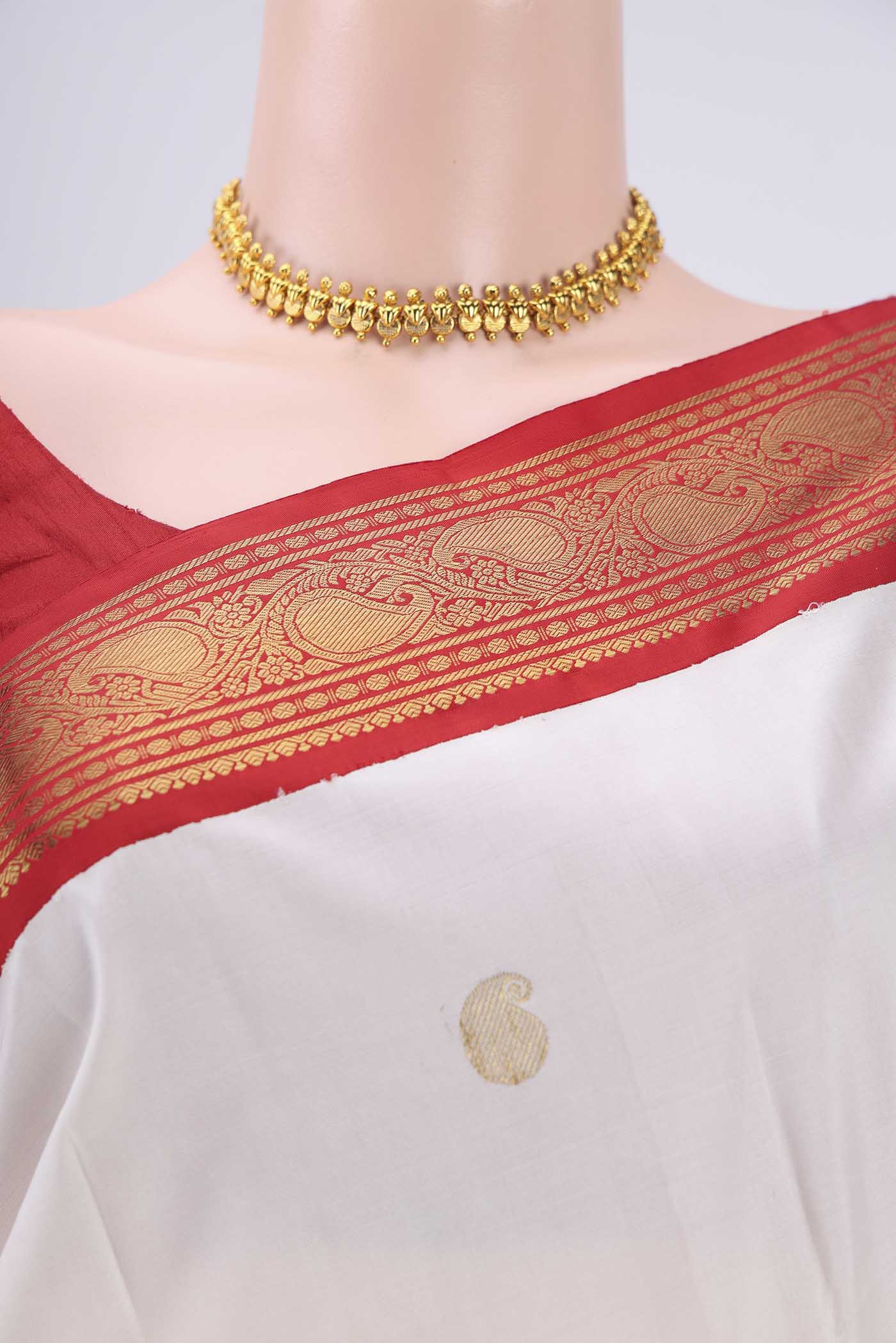 Border image of White Kanjivaram Saree with Zari Butta on the body and Zari Border. 