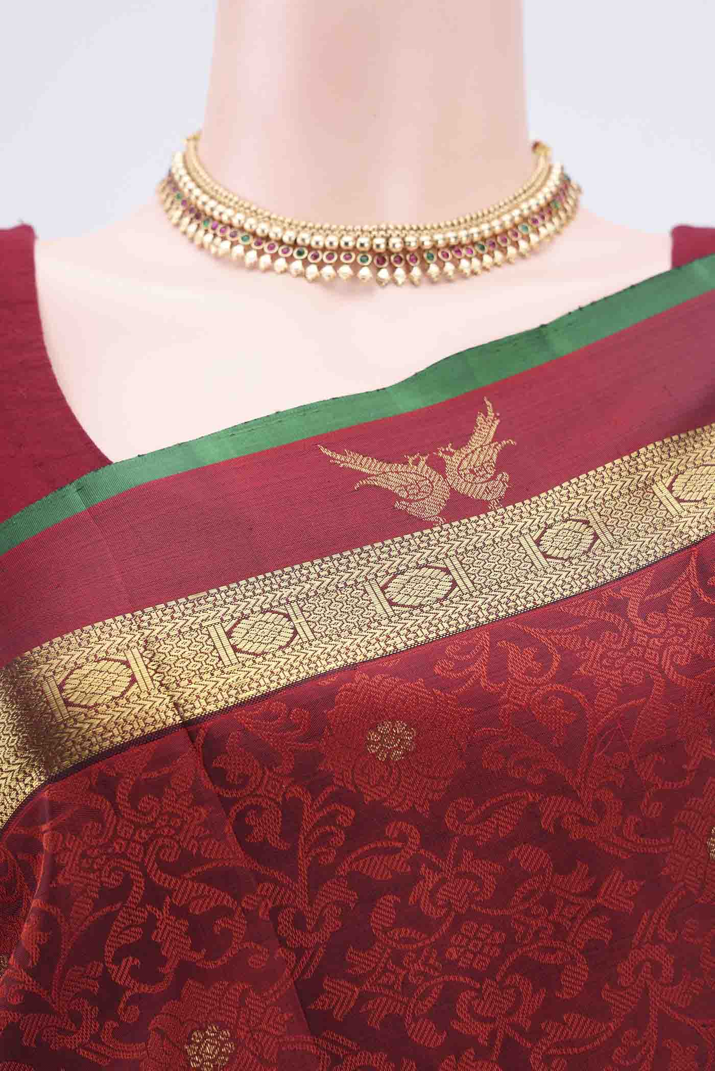 Border image of Maroon Kanchipuram Silk Saree with Jacquard With Zari Butta on the body and Zari Border. 