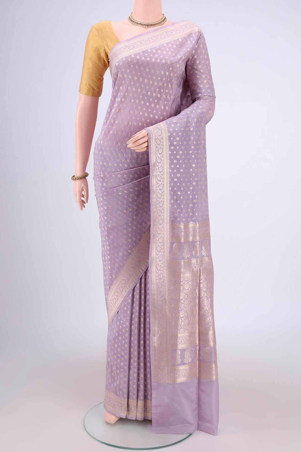Lavender Dual Tone Banarasi Silk Saree with Zari Butta on the body and Zari Border.  displayed on a mannequin