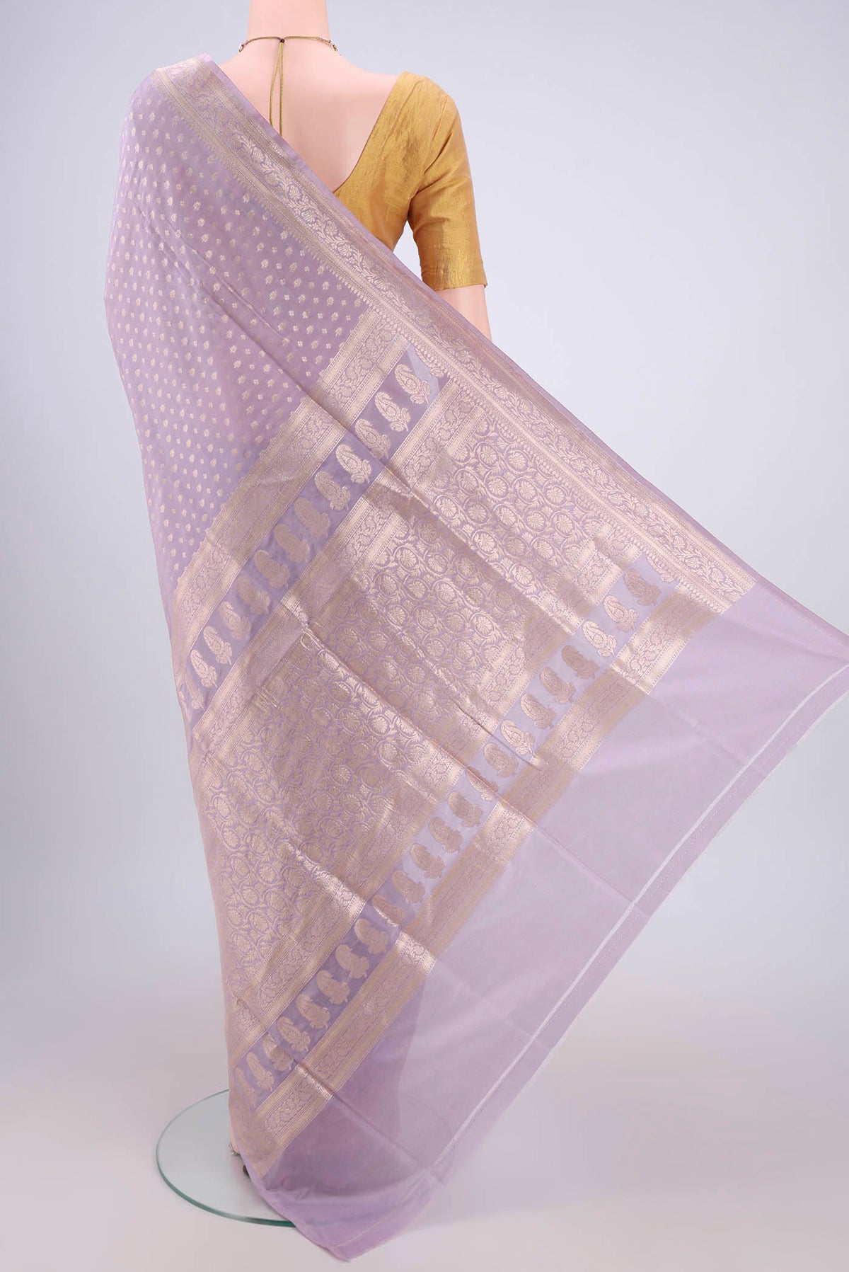 Flat view of Lavender Dual Tone Banarasi Silk Saree with Zari Butta on the body and Zari Border. 