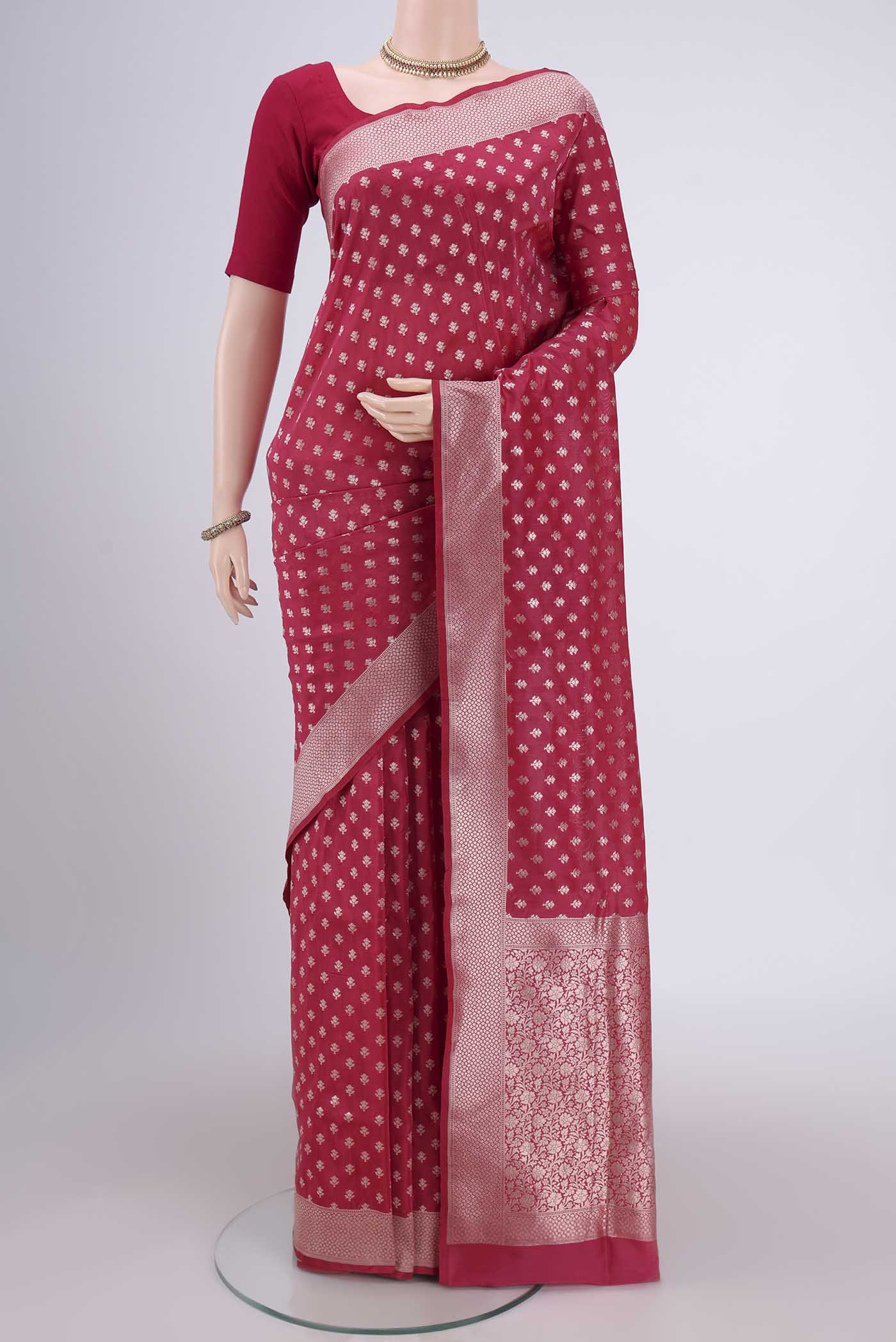 Rose pink Banarasi Silk Saree with Zari Butta on the body and Zari Border.  displayed on a mannequin