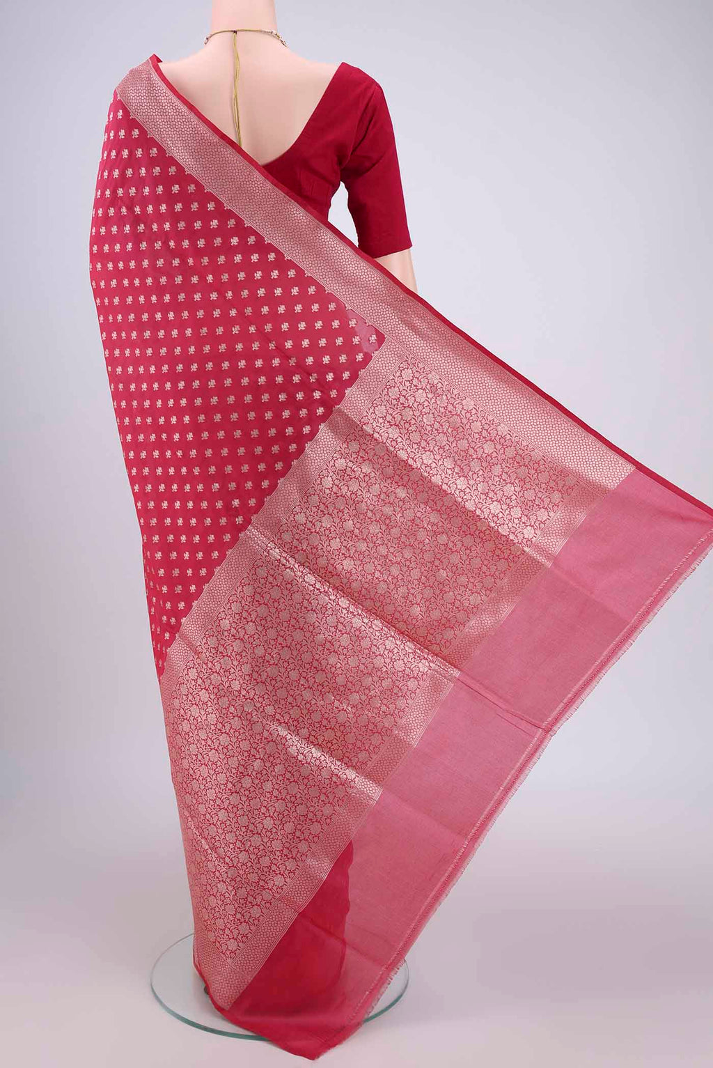 Flat view of Rose pink Banarasi Silk Saree with Zari Butta on the body and Zari Border. 
