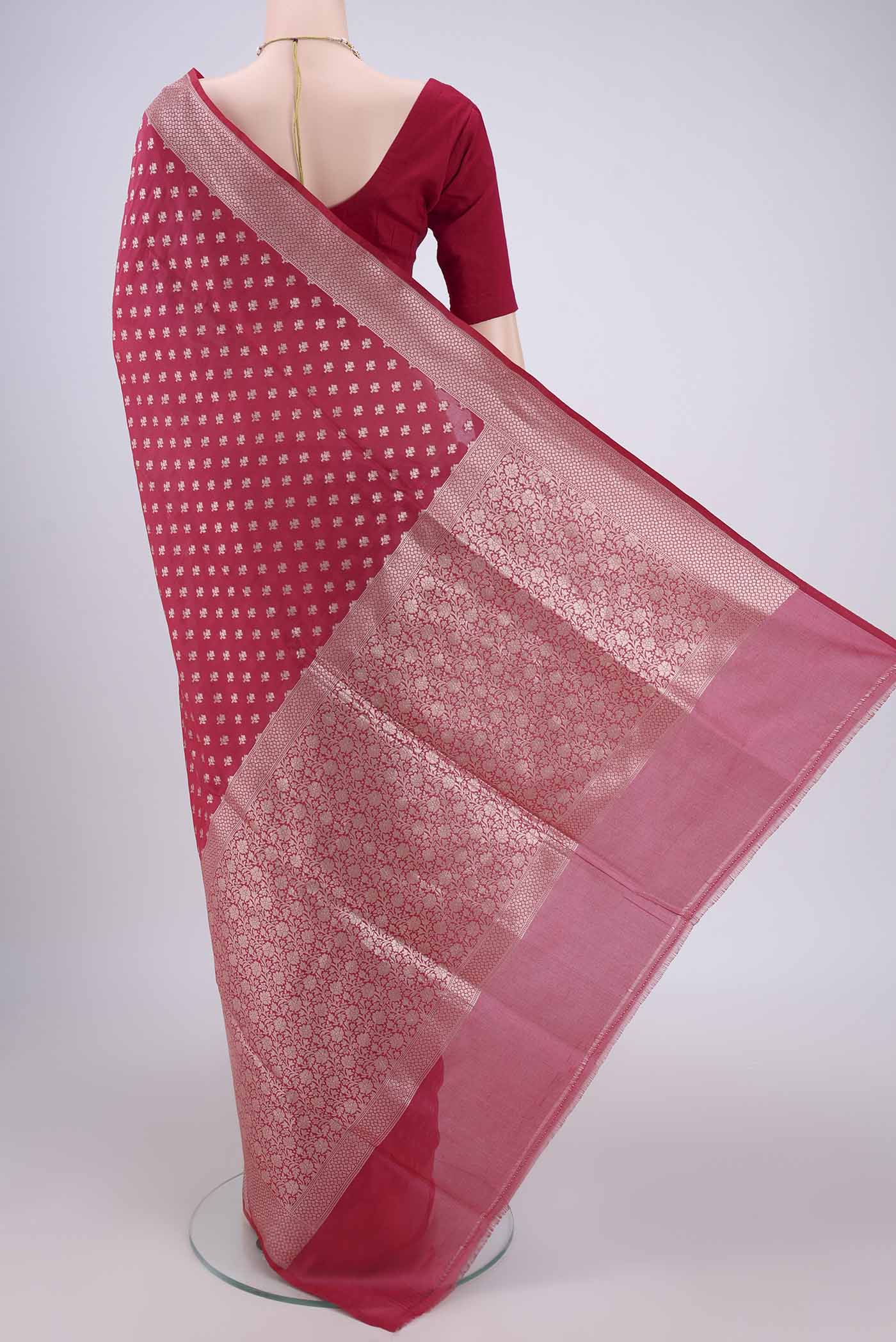 Flat view of Rose pink Banarasi Silk Saree with Zari Butta on the body and Zari Border. 
