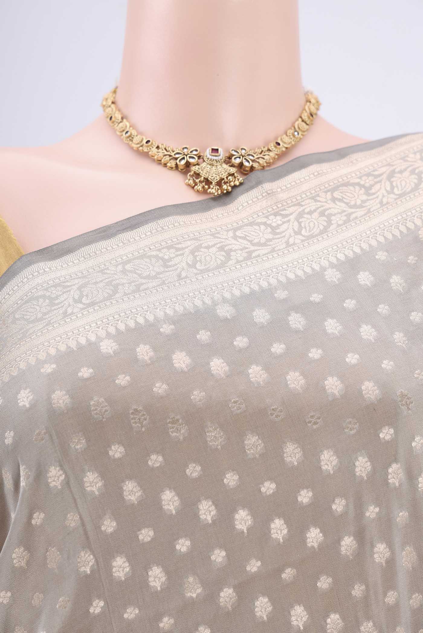 Border image of Grey Banarasi Silk Saree with Zari Butta on the body and Zari Border. 