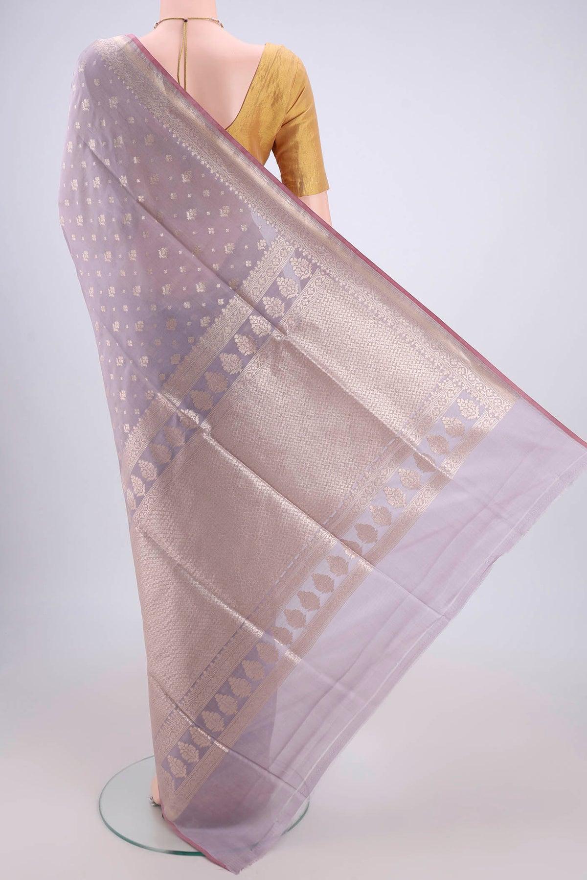 Flat view of Lavender Dual Tone Banarasi Silk Saree with Zari Butta on the body and Zari Border. 