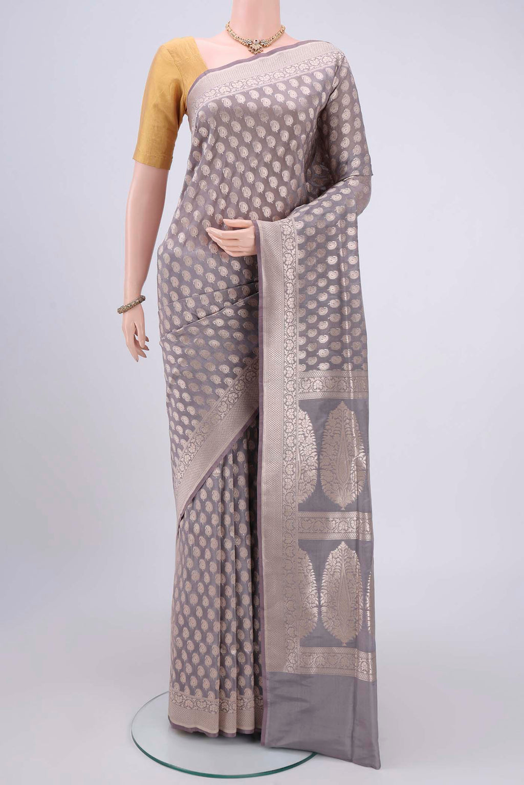 Grey Bangalore Silk Saree with Zari Butta on the body and Zari Border.  displayed on a mannequin