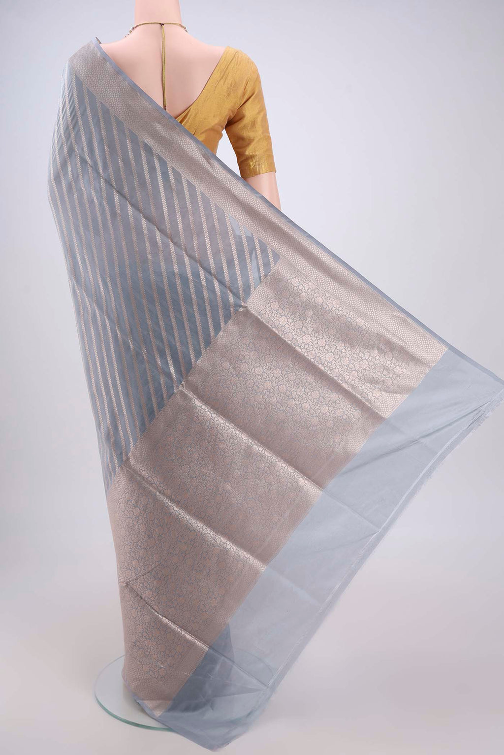 Flat view of Blue Grey Banarasi Silk Saree with Stripes on the body and Zari Border. 
