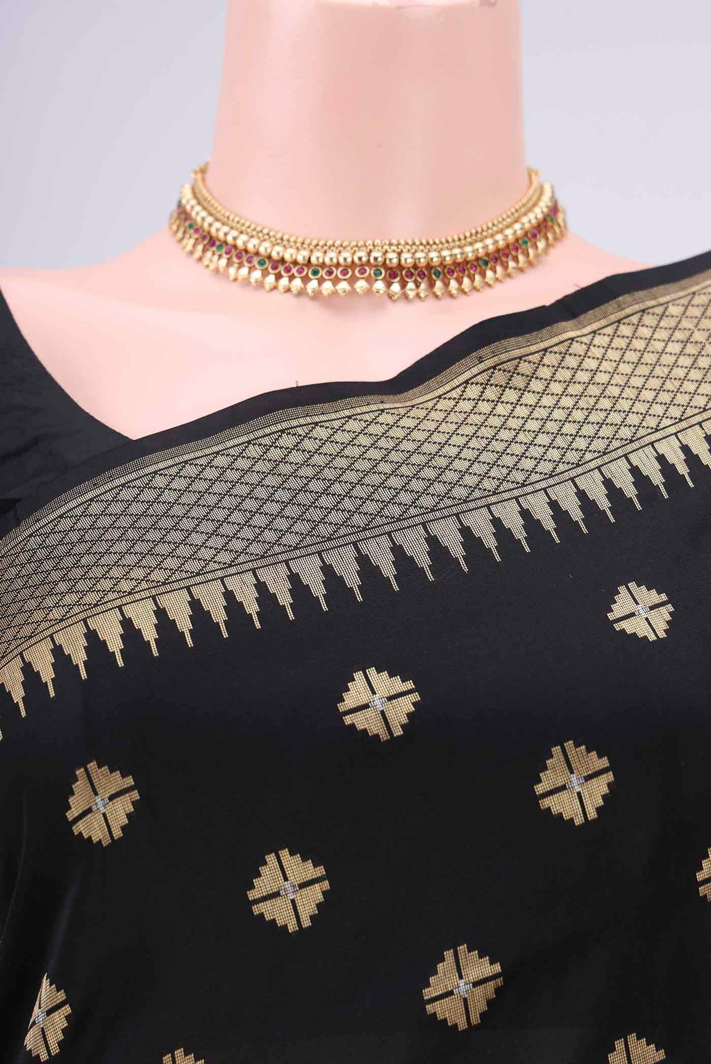 Border image of Black Banarasi Silk Saree with Zari Butta on the body and Temple Border. 