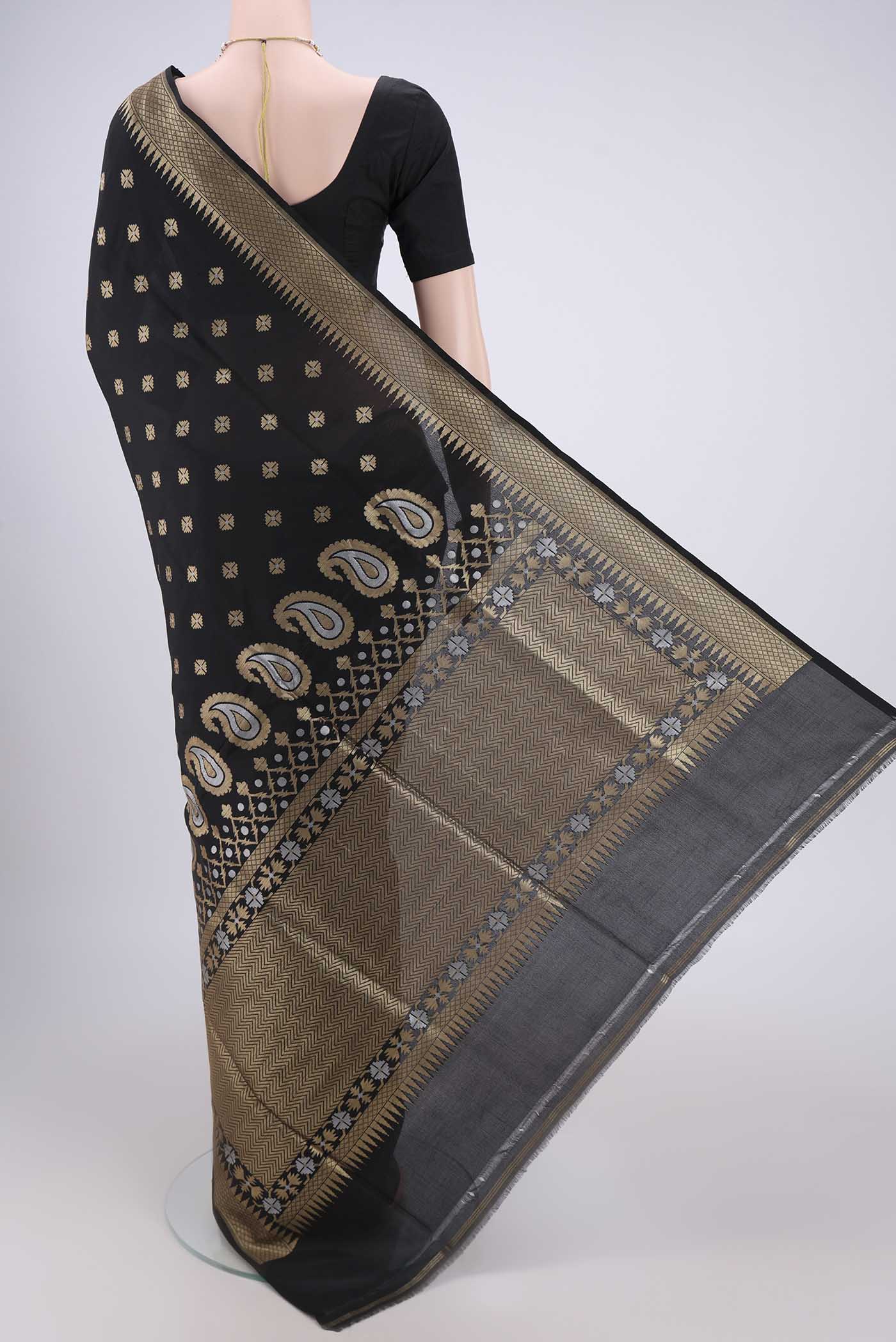 Flat view of Black Banarasi Silk Saree with Zari Butta on the body and Temple Border. 