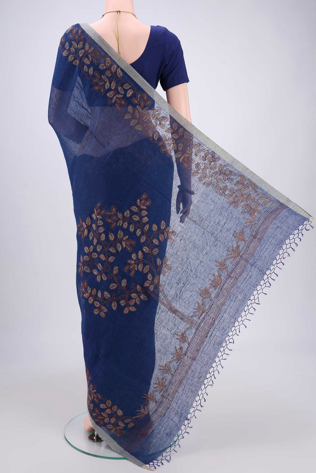 Flat view of Blue Linen Saree with Kantha Work on the body and Plain Border. 