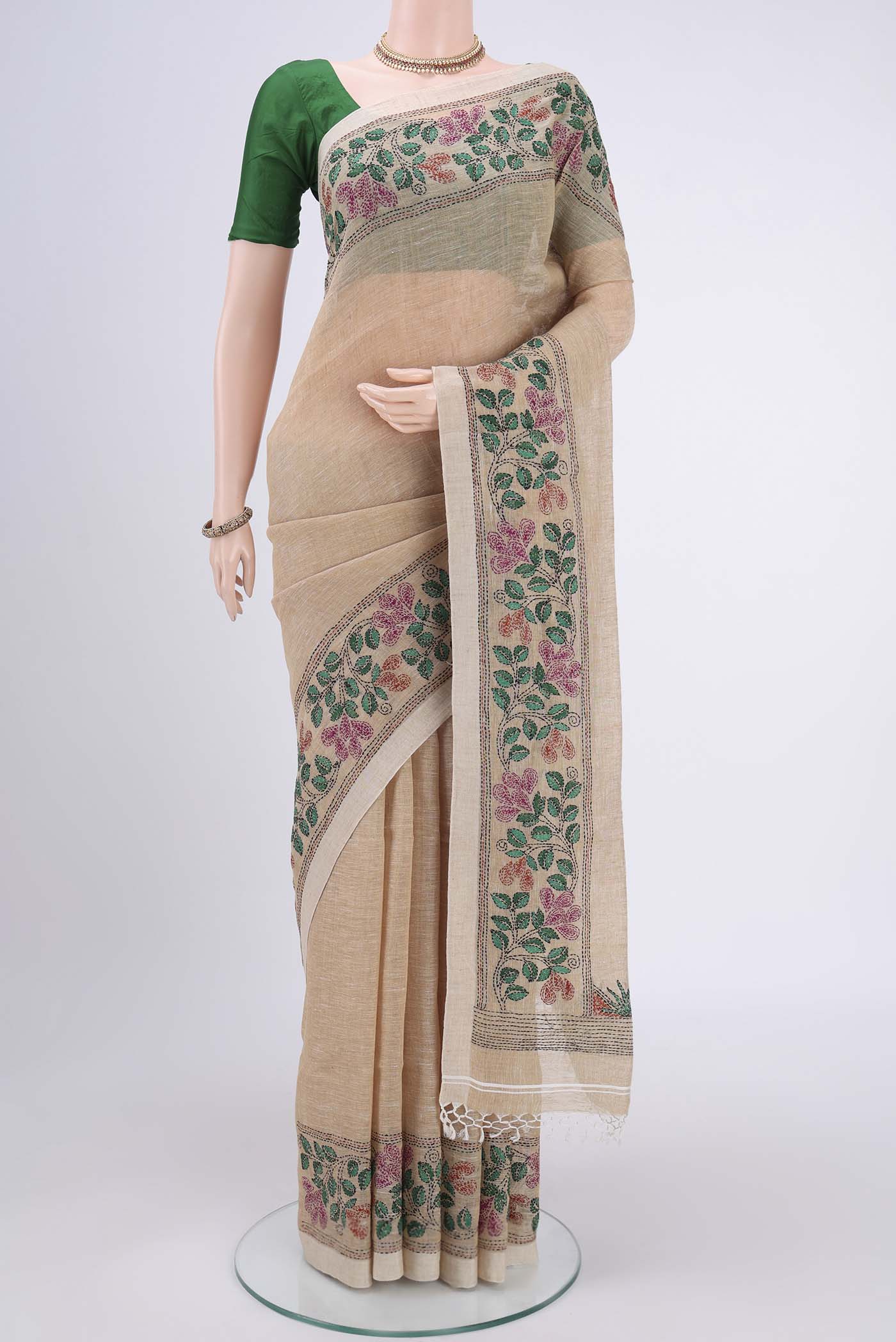 Beige Linen Saree with Plain Body and Thread Border.  displayed on a mannequin