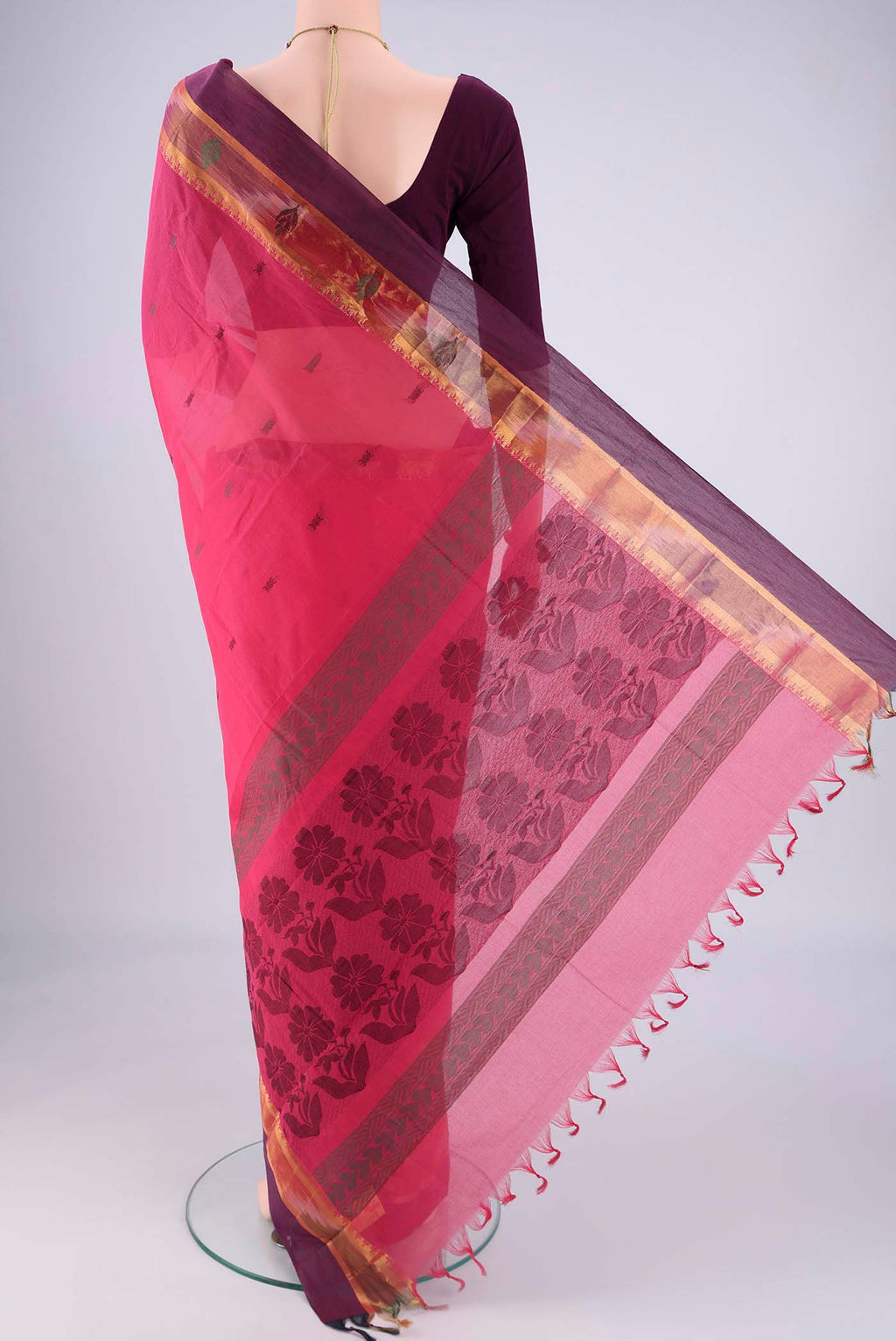 Flat view of Pink Kanchi Cotton Saree with Thread Butta on the body and Zari Border. 